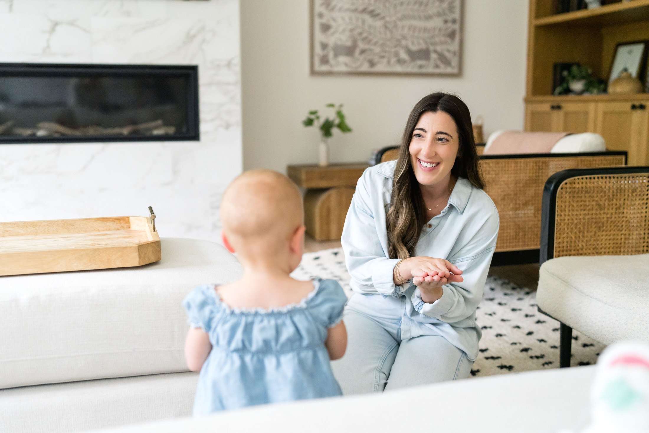 Nanny with a toddler in the living room for Stork Maternity Consulting