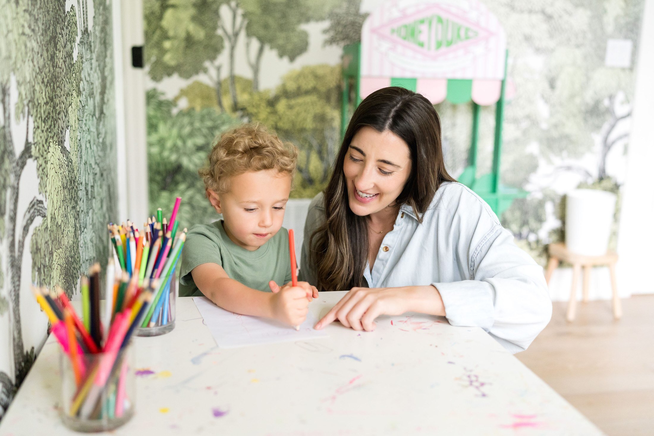 Nanny doing arts and crafts with a child for Stork Maternity Consulting in Austin