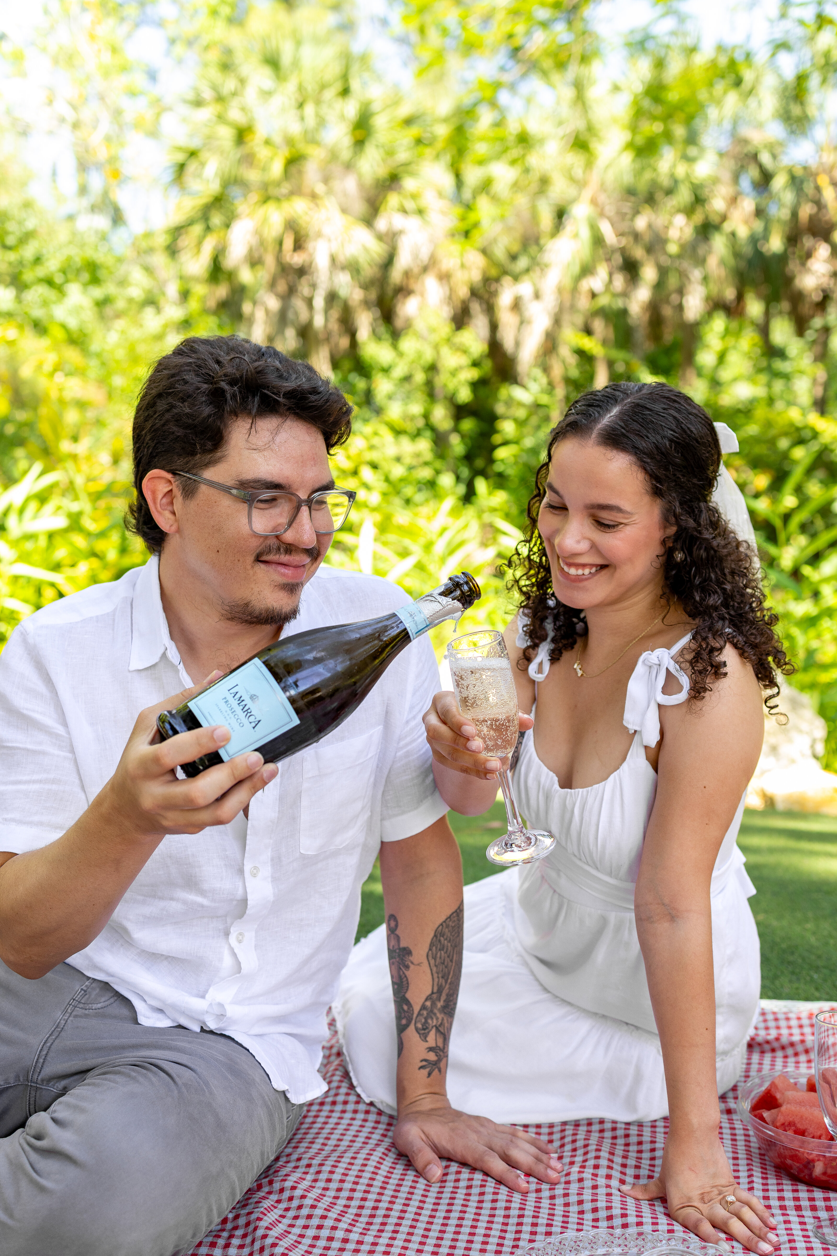 Couple celebrating with champagne elopement in Florida