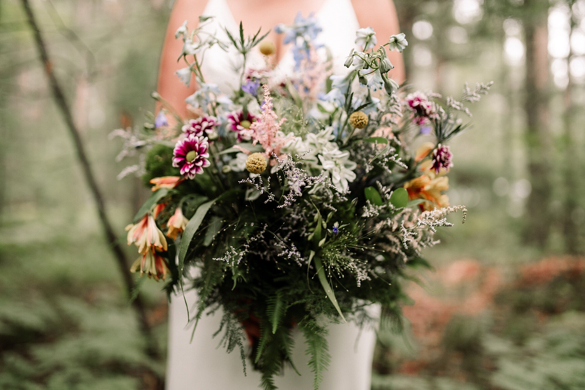 Wedding bouquet in a wooded setting