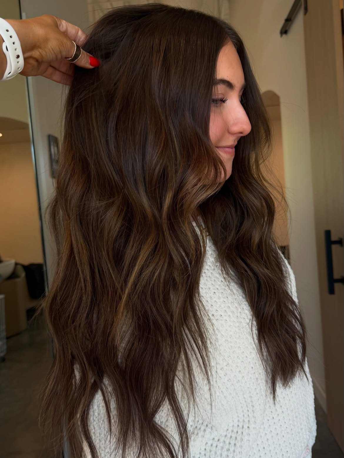 Brunette hair color and hand-tied extensions done at our salon in Eagle, Idaho