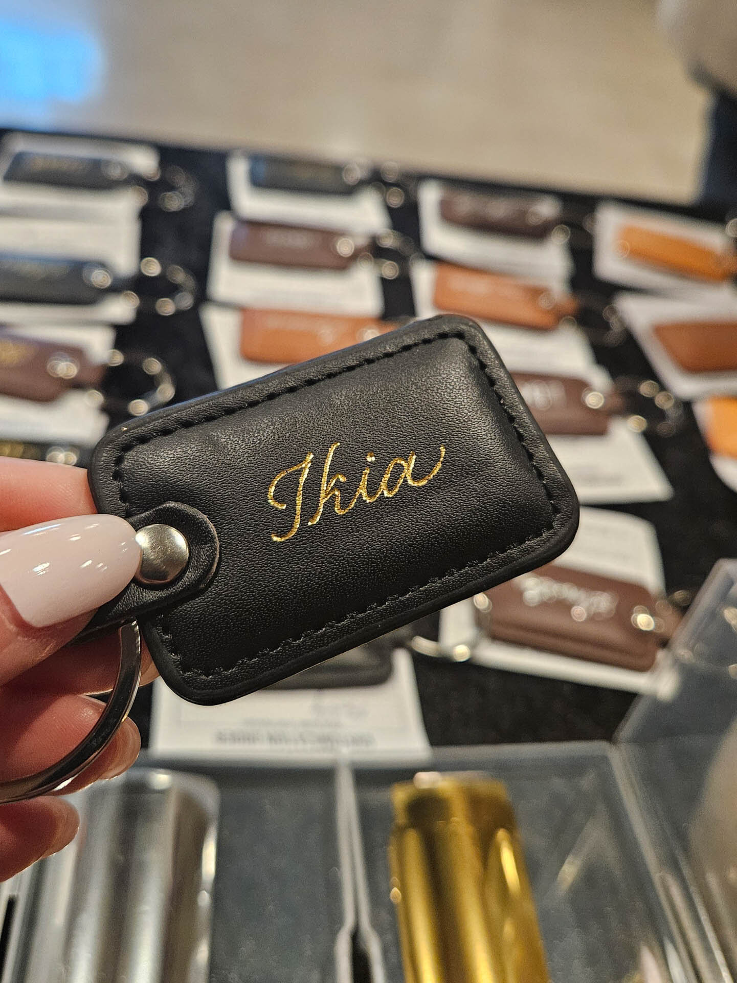 Custom foiled keychain brand gifting live calligraphy