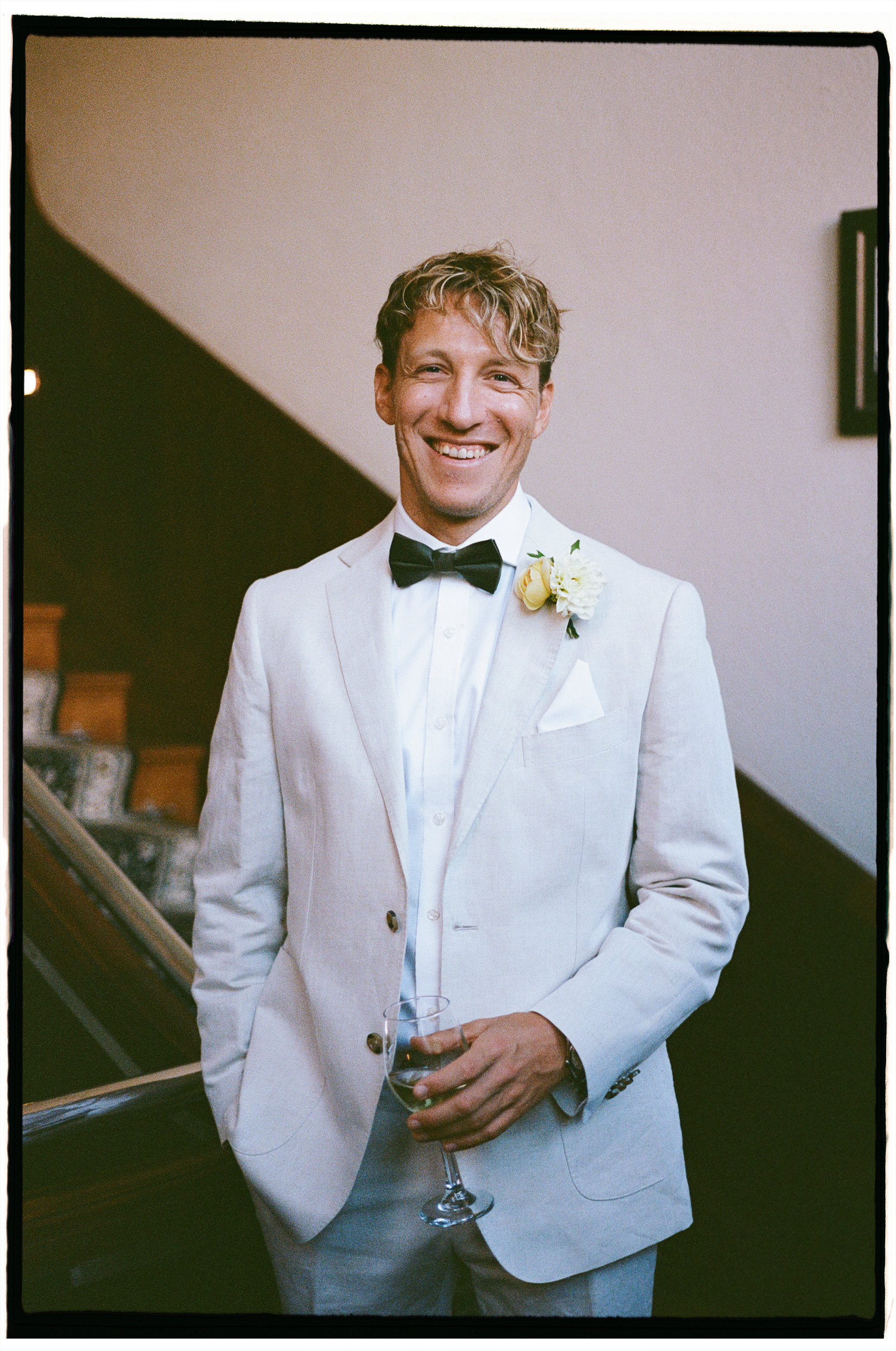 Soft natural light and intimate getting-ready moments at Caves House Hotel on analogue film