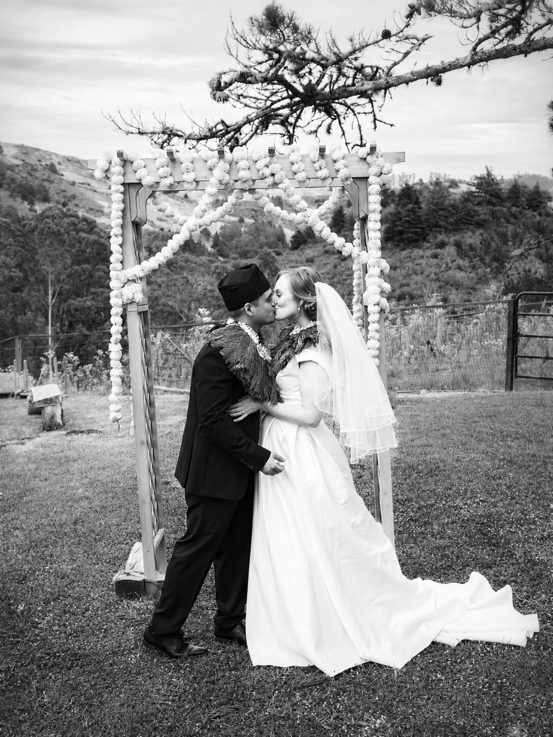 Black and white wedding first kiss