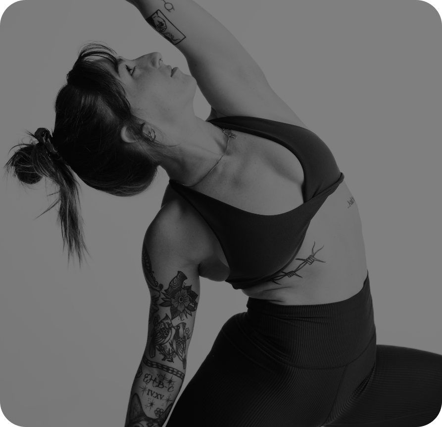 An instructor moving through a yoga pose