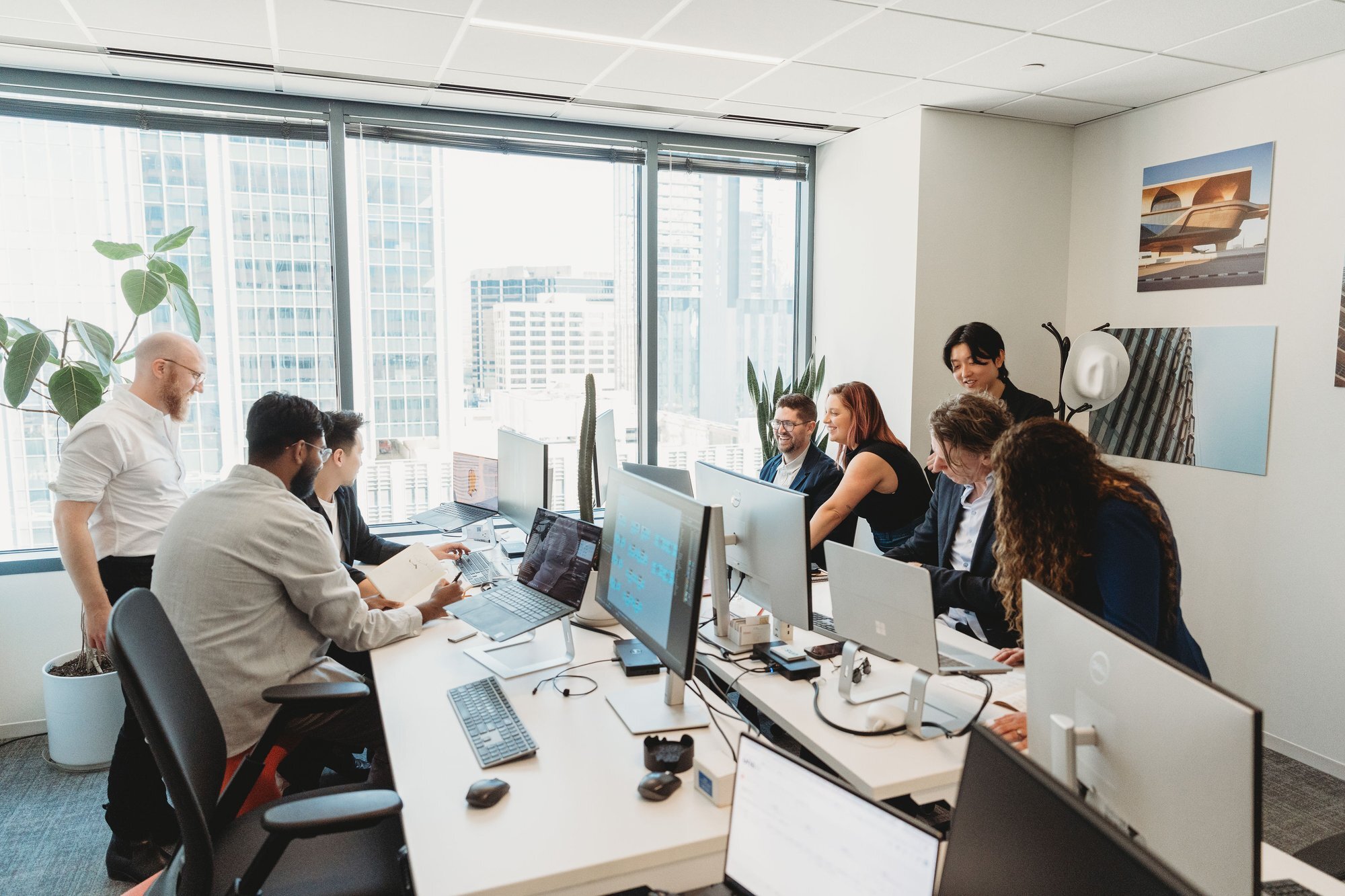 UNS corporate team photography at a workstation in the Austin office