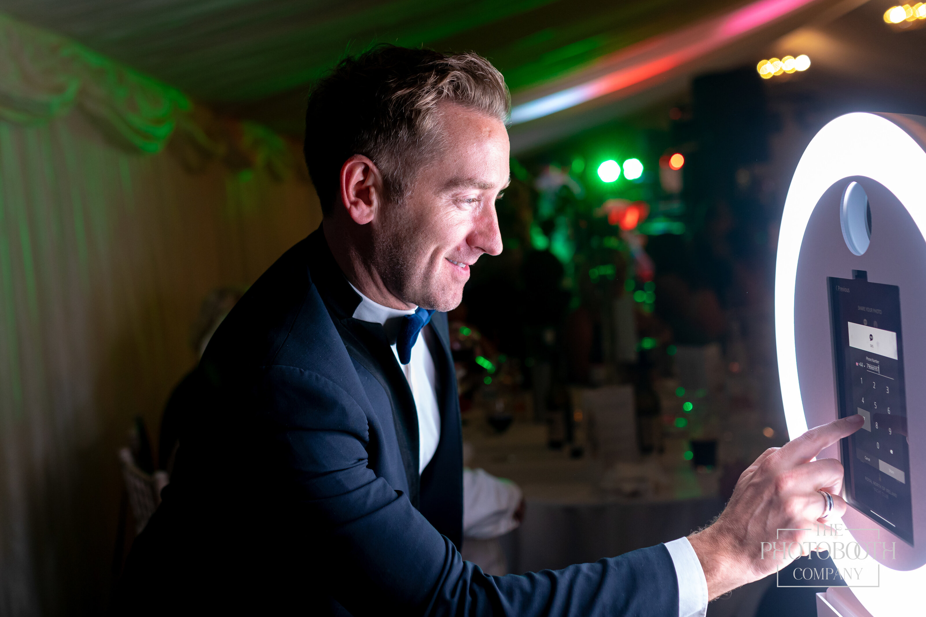 Guests at an Orlando corporate event using the digital photo booth for instant sharing