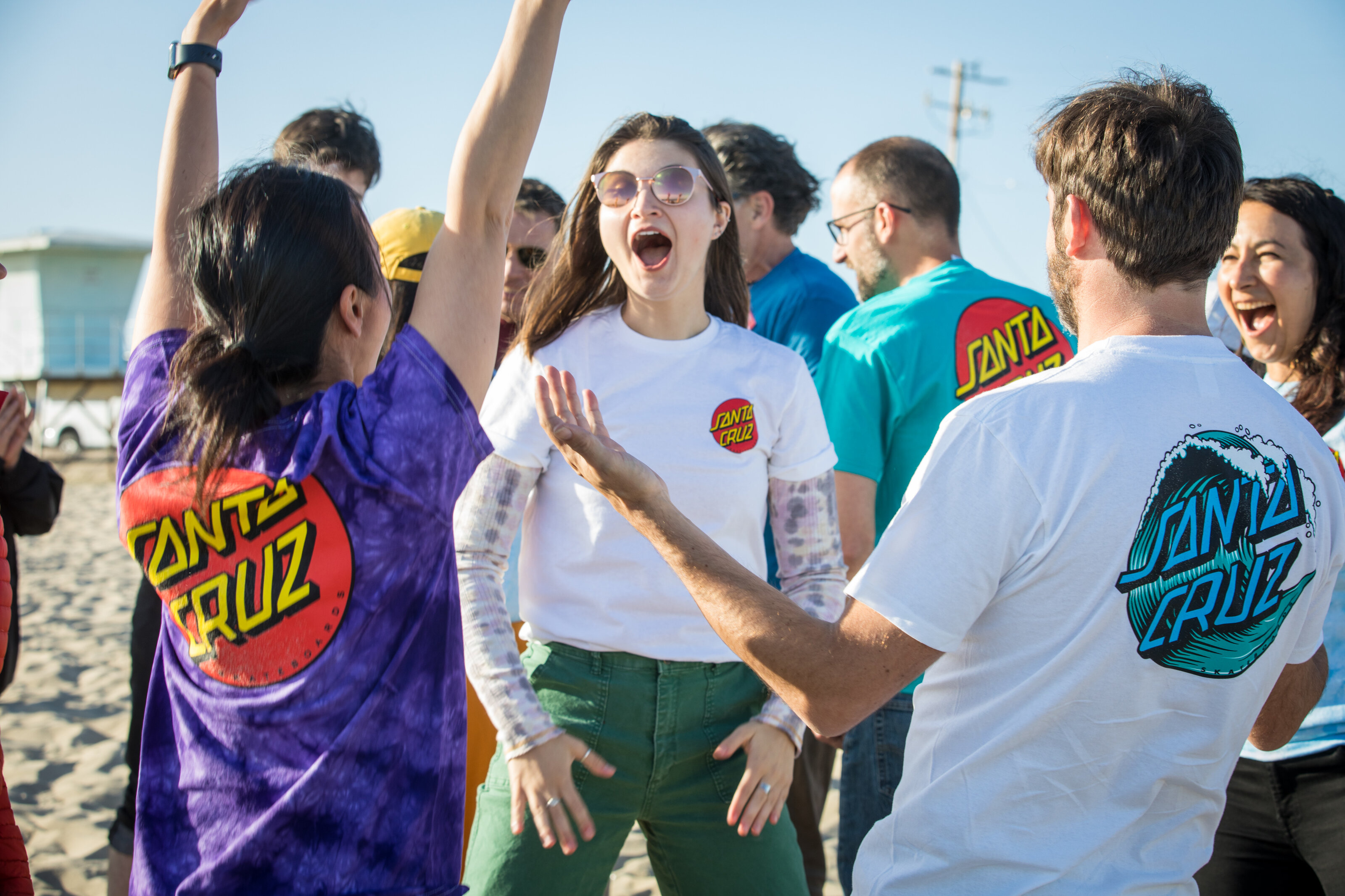 Two team members celebrating together during an Enliven offsite