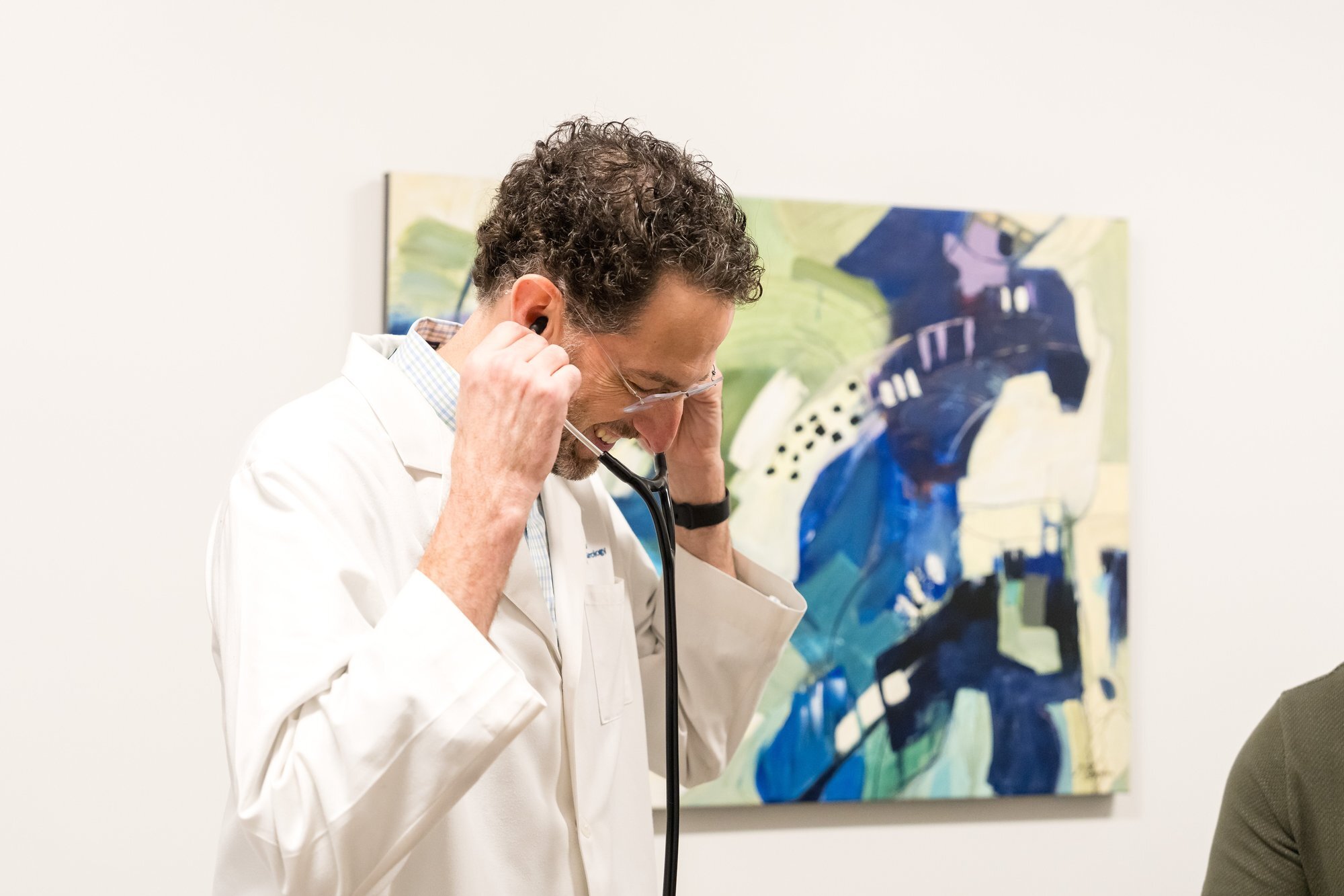 Austin Gastroenterology exam room, physician with stethoscope