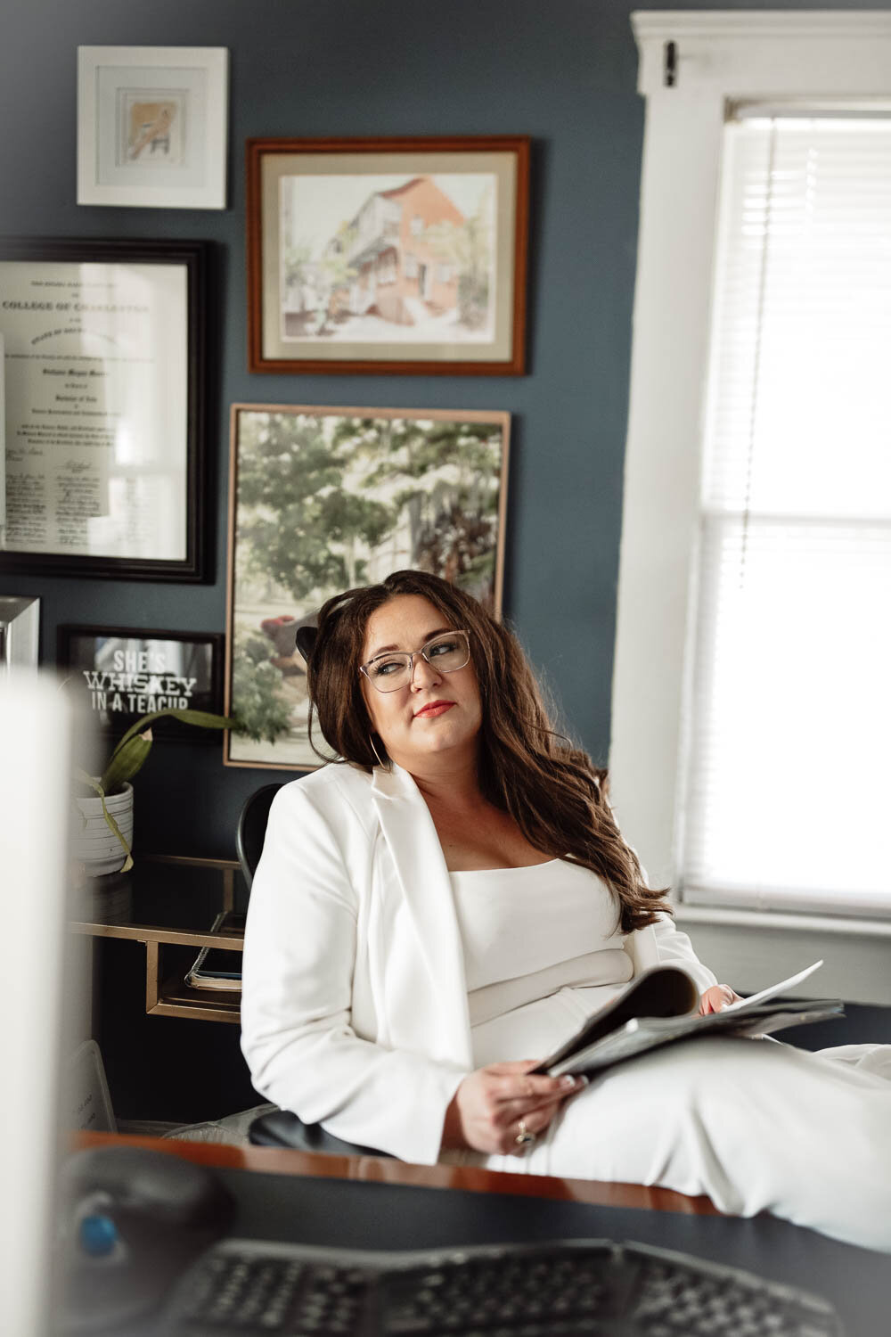 About Stefanie morris, founder of morris and co, seated in a white suit