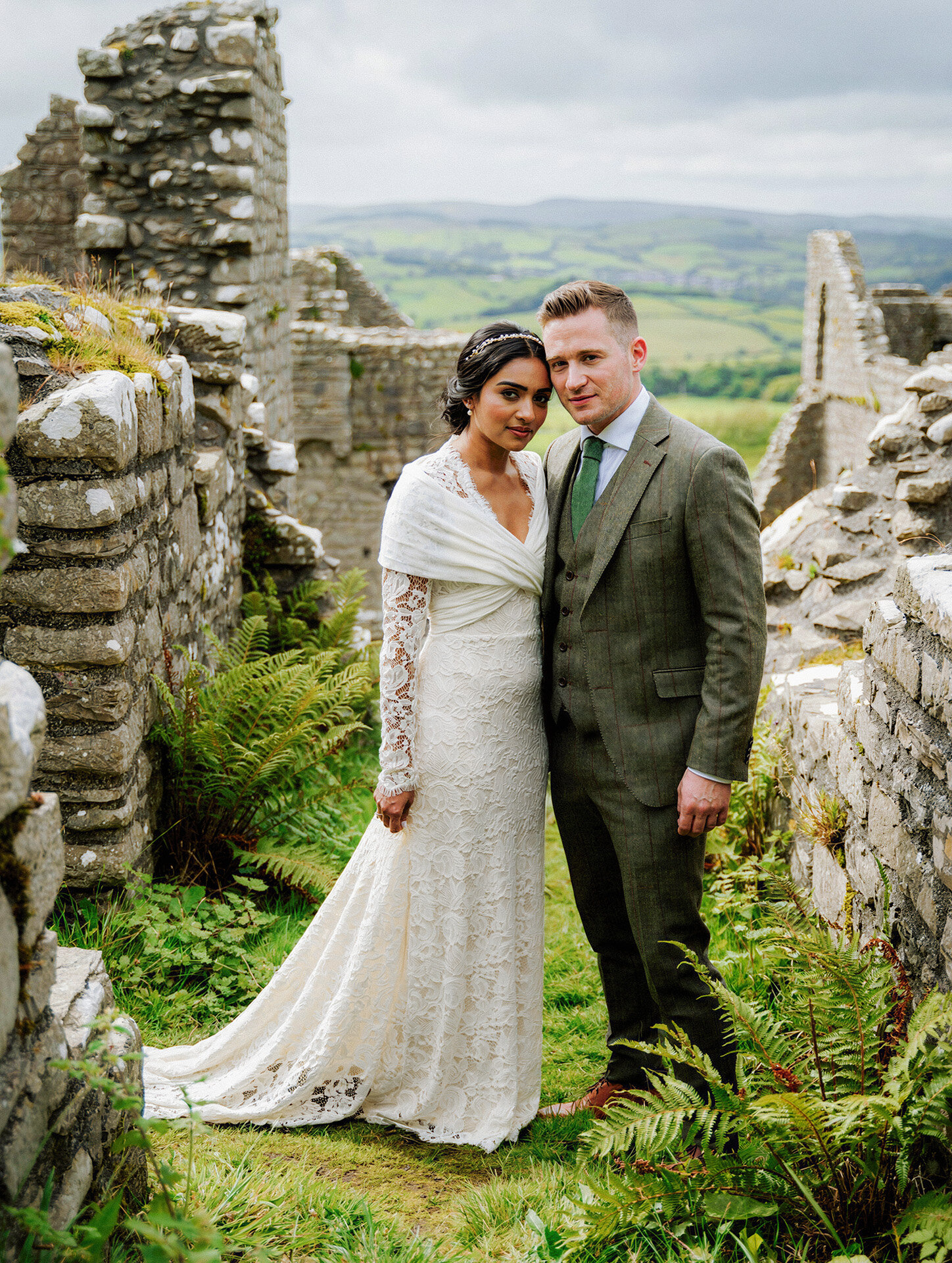 Bride and groom portrait at historic farmhouse ruins in Ireland with true-to-life wedding photography
