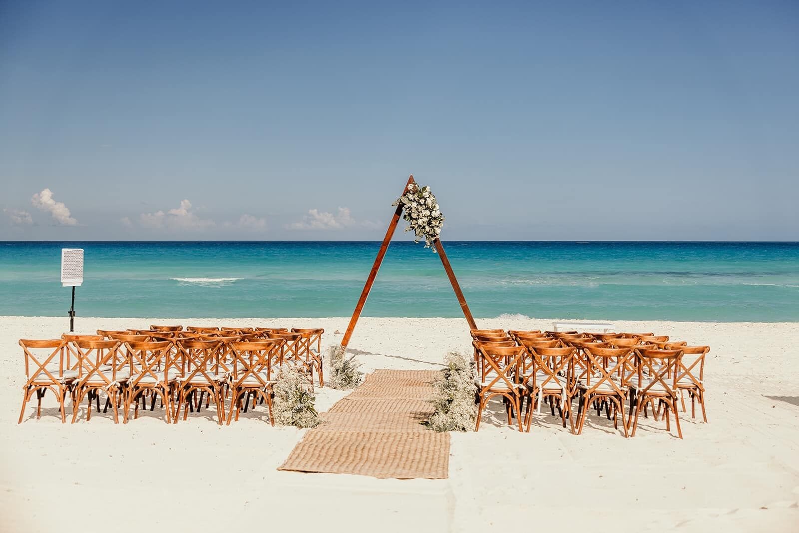 Beach wedding ceremony setup at Live Aqua Cancun