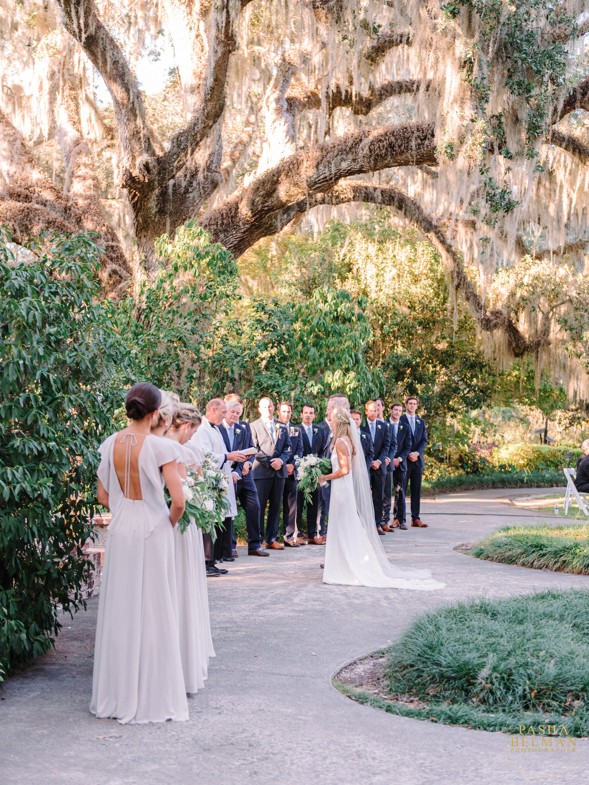 Outdoor wedding ceremony beneath live oak trees at Brookgreen Gardens near Pawleys Island, SC