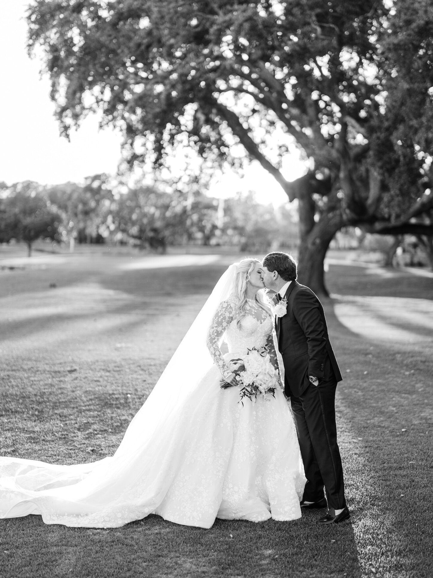 Black and white bride and groom wedding portrait beneath a live oak tree in Pawleys Island, SC
