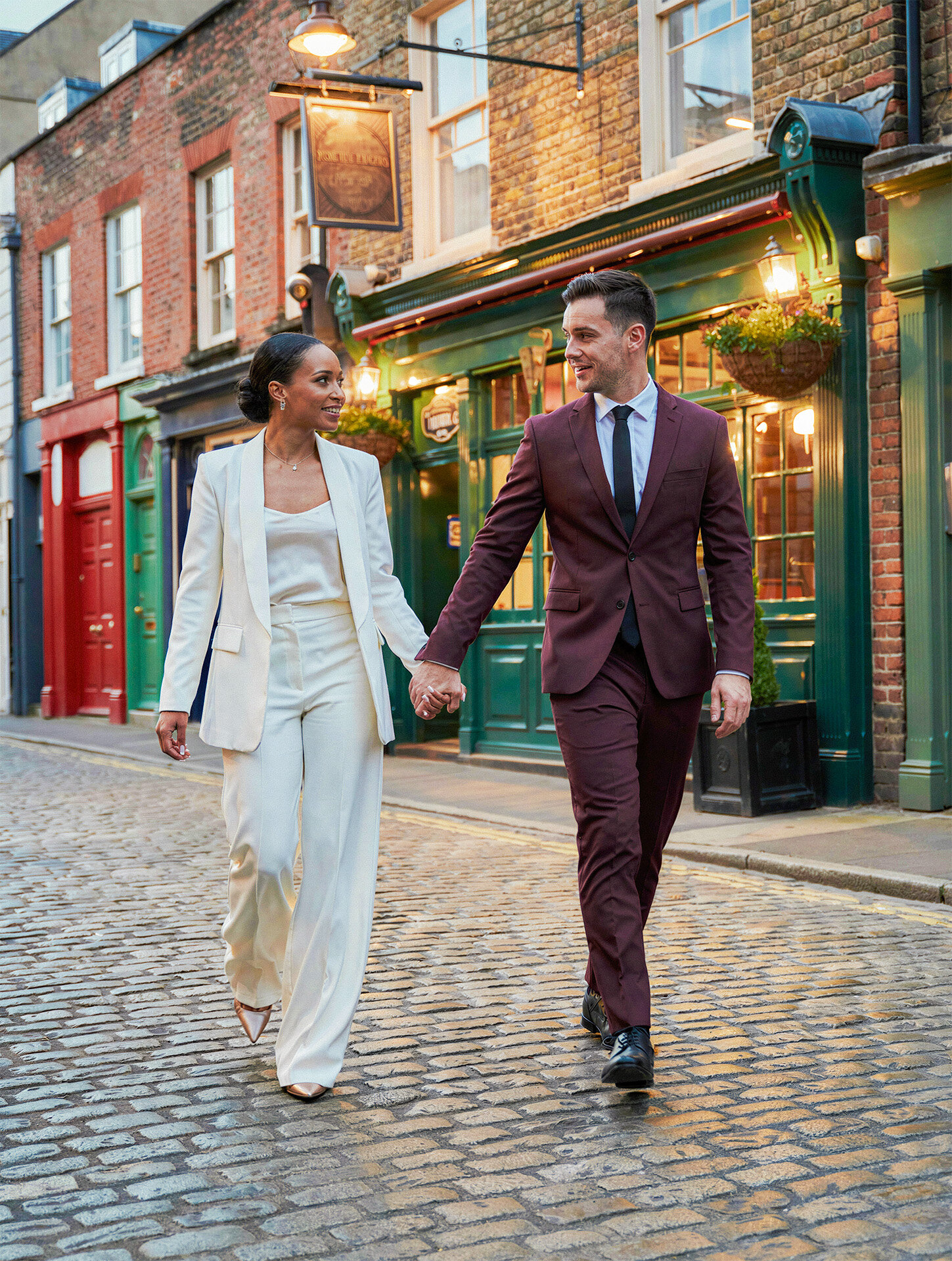 Bride and groom portrait in a cobblestone alley by an Ireland destination wedding photographer