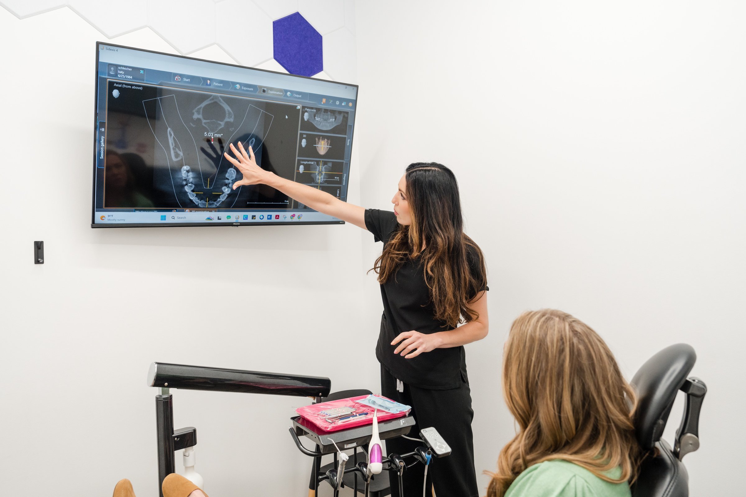 Drip Dental team member reviewing 3D dental xray scan, Dripping Springs