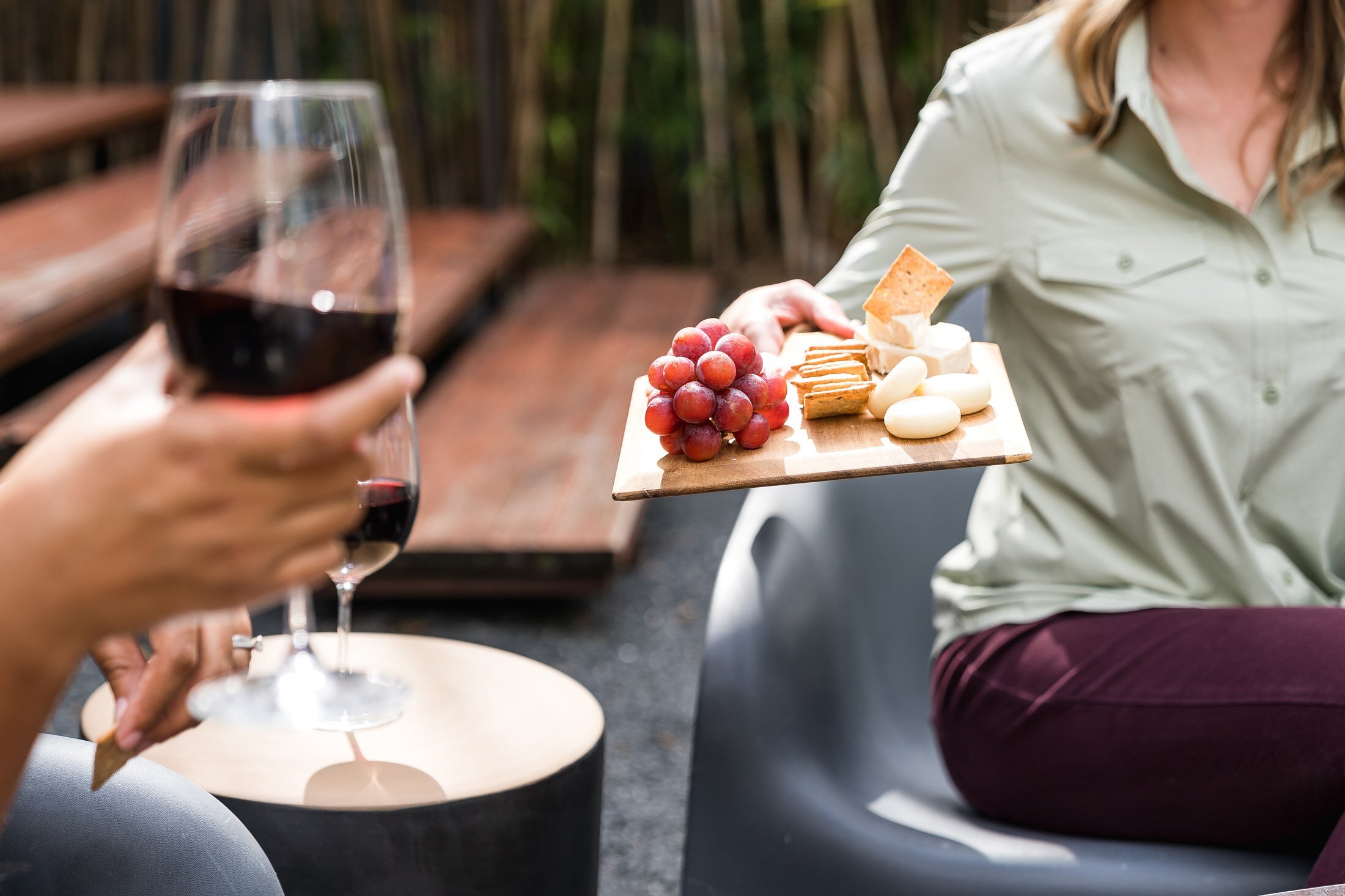 Guest enjoying wine and cheese on the patio at a Vacasa rental in Austin