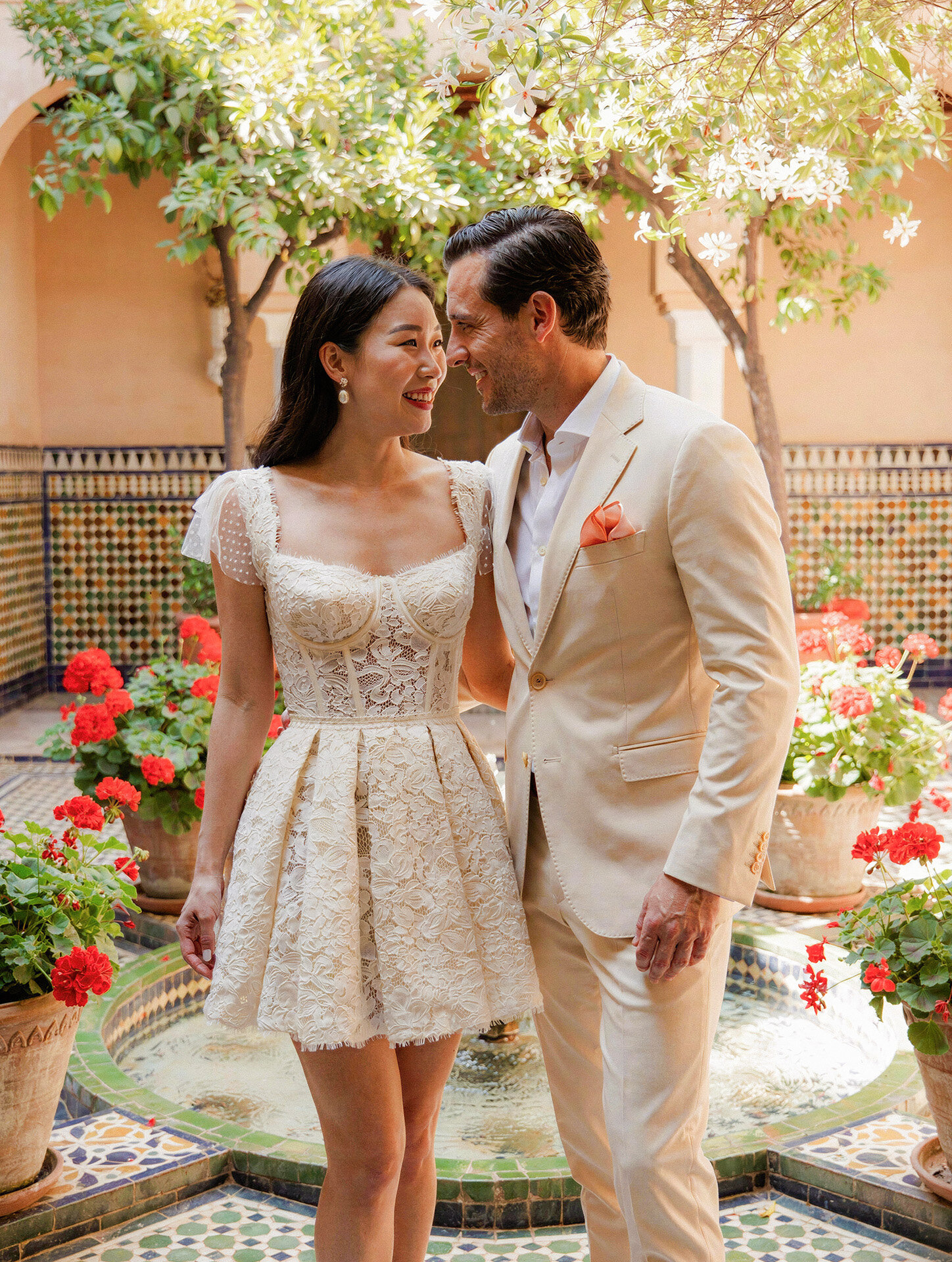 Bride and groom portrait in a traditional Andalusian courtyard in Seville, Spain
