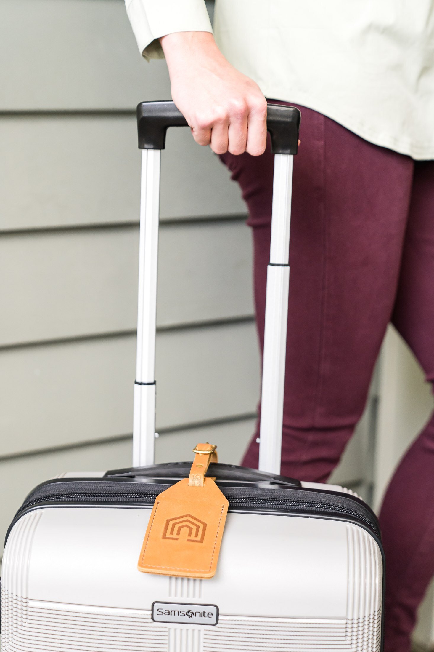 Detail of a Vacasa branded luggage tag in Austin