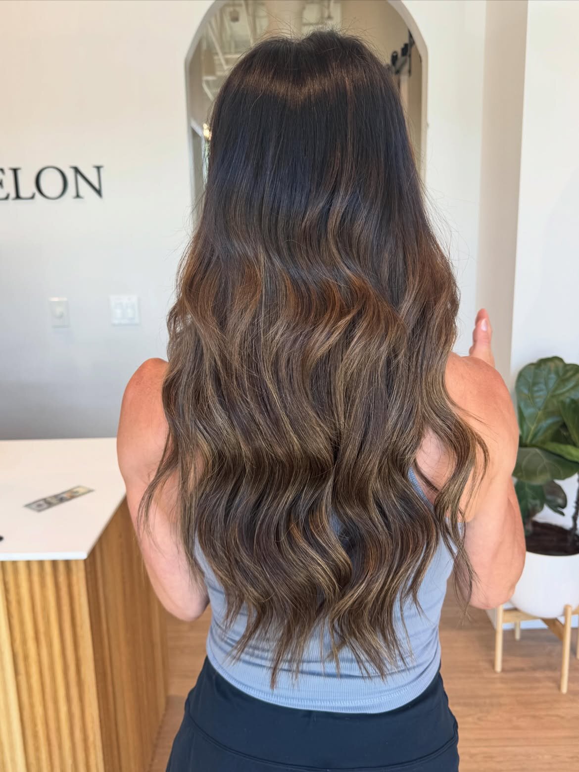 Brunette hair color, balayage, lived-in color and hand-tied extensions done at our salon in Eagle, Idaho