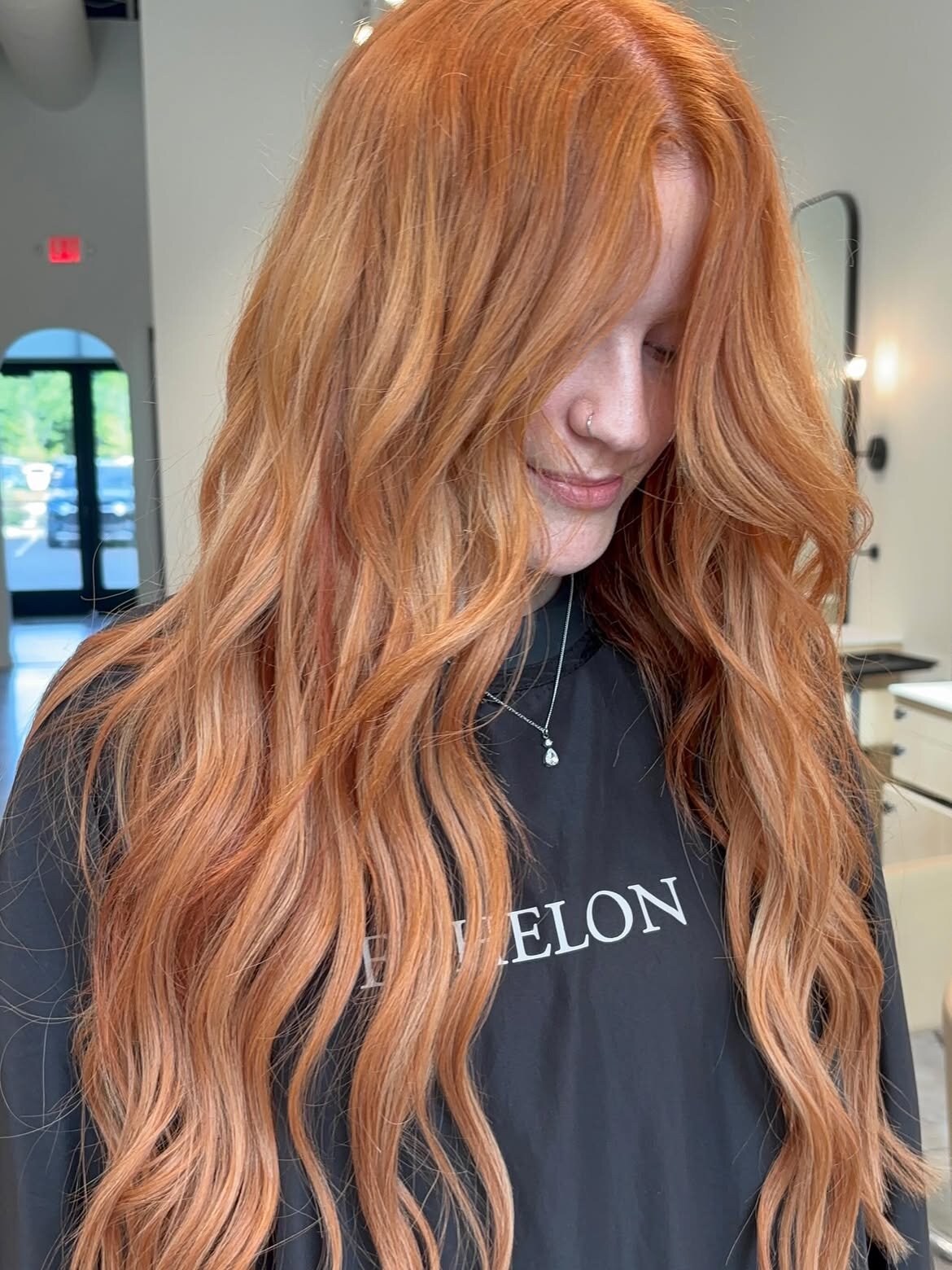Red hair color and hand-tied extensions by the team at Echelon Salon in Eagle, Idaho
