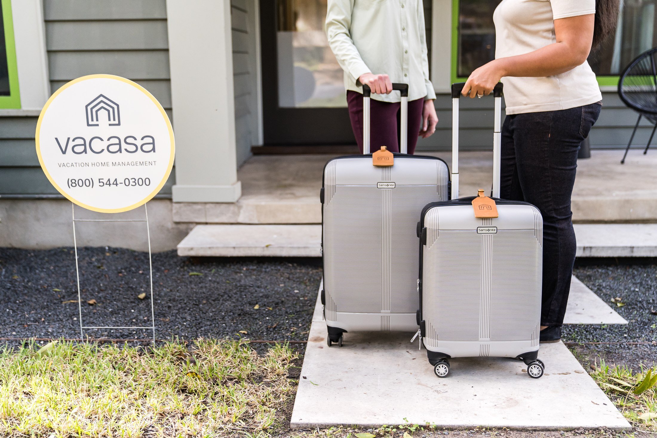 Guests arriving at a Vacasa vacation rental property with the yard sign in Austin