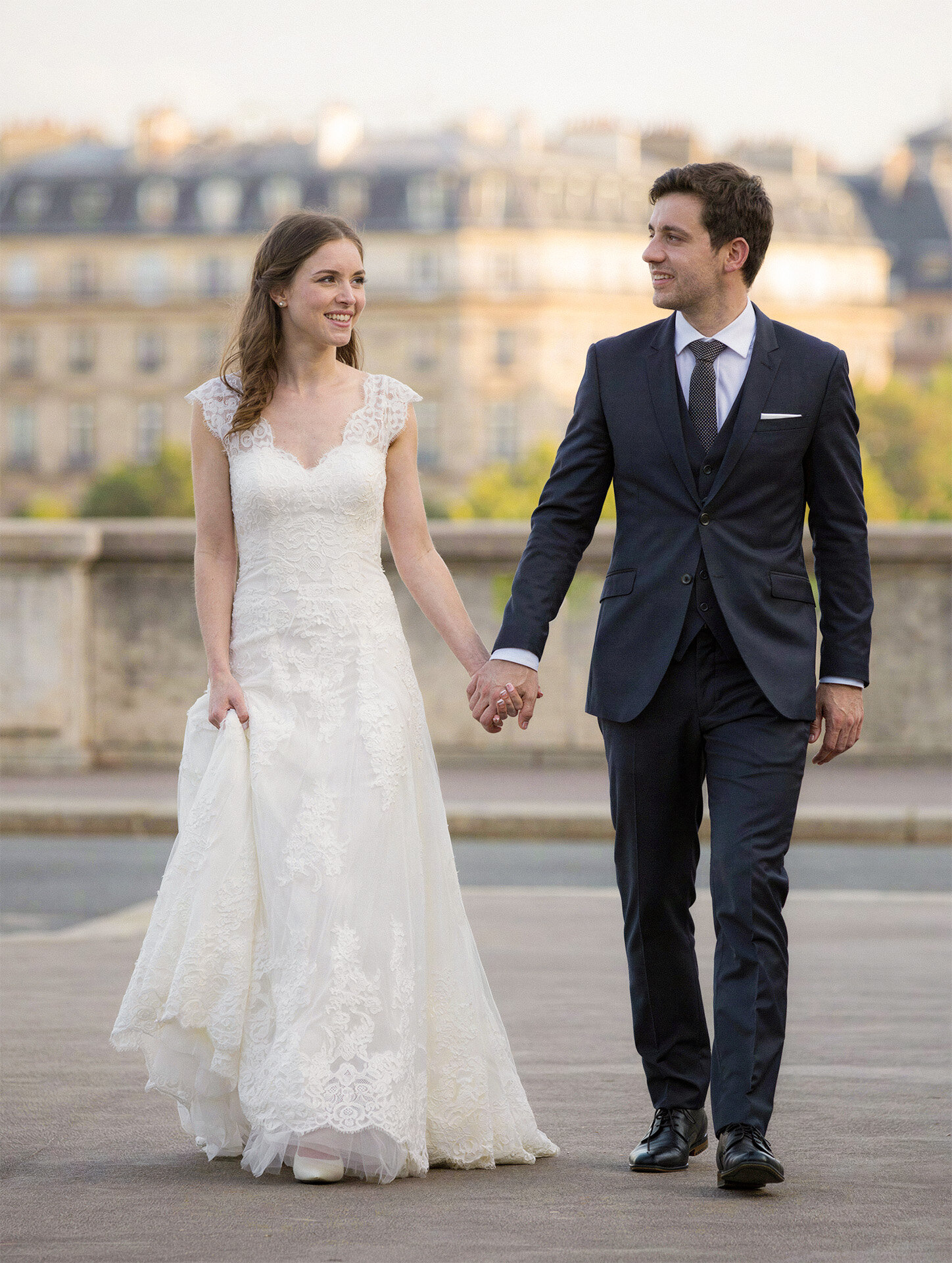 Bride and groom walking during a destination wedding in Paris, France