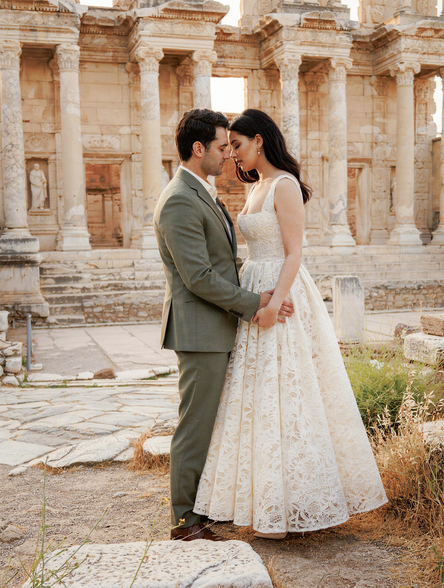 Bride and groom at the Library of Celsus in Ephesus photographed by Turkey destination wedding photographer 4Karma Studio