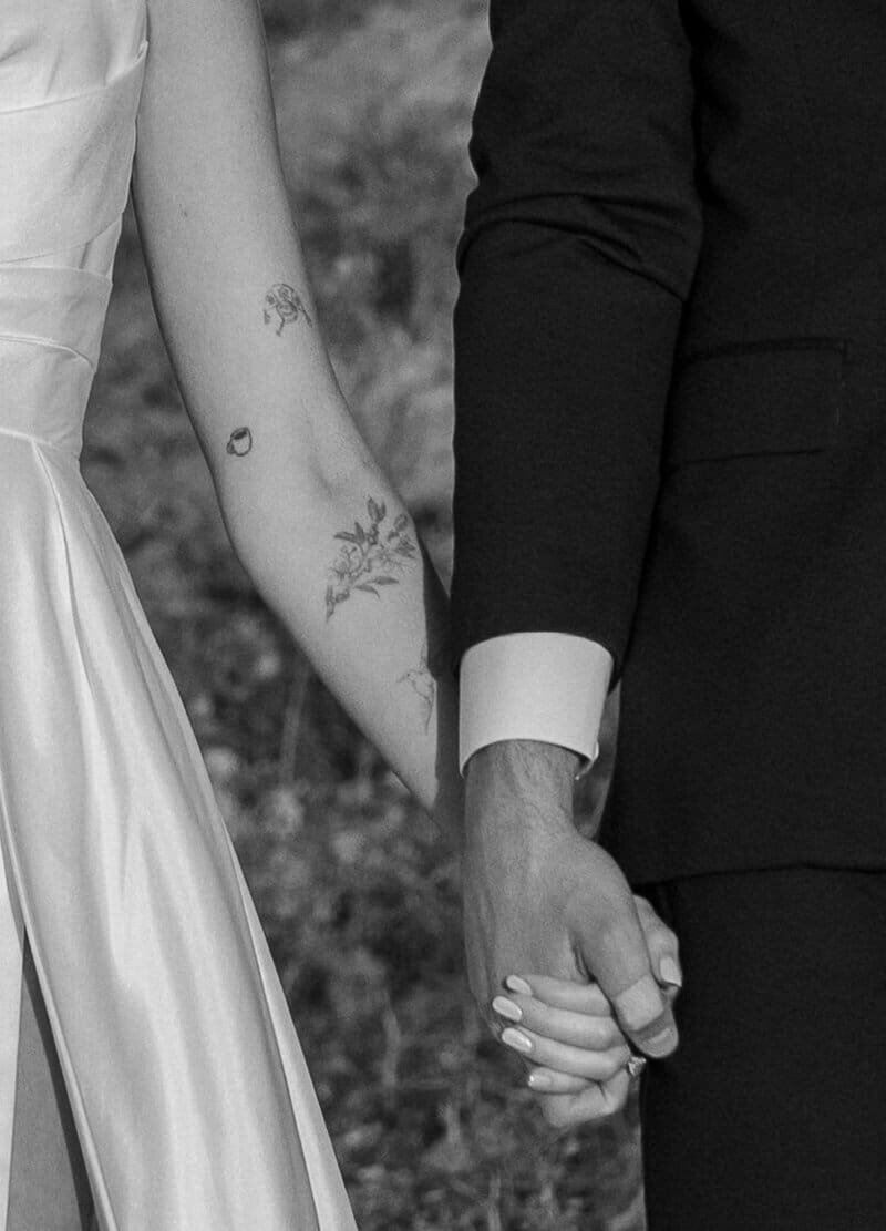 Black and white close-up of a couple holding hands in temecula, CA