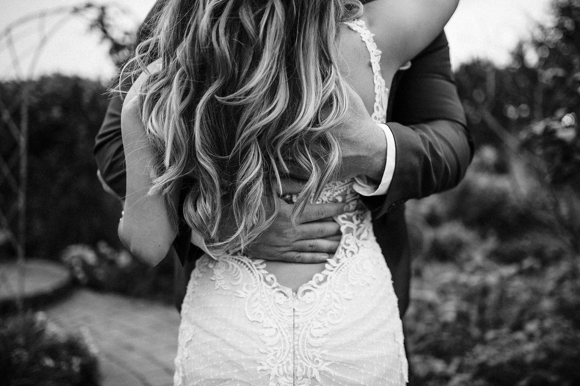 Bride from behind showing the back of her wedding dress