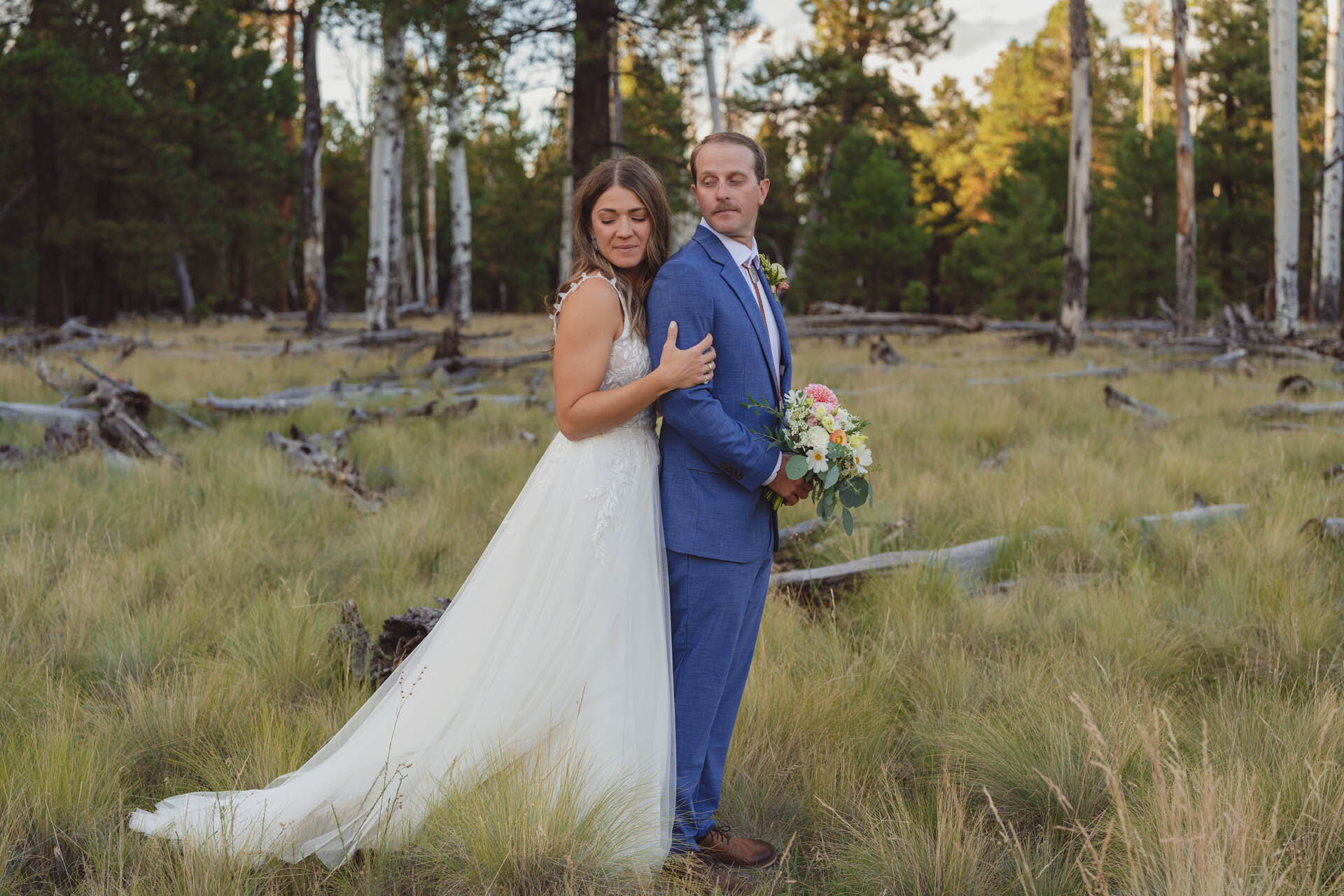 Couple getting married in Flagstaff in spring surrounded by Ponderosa pines