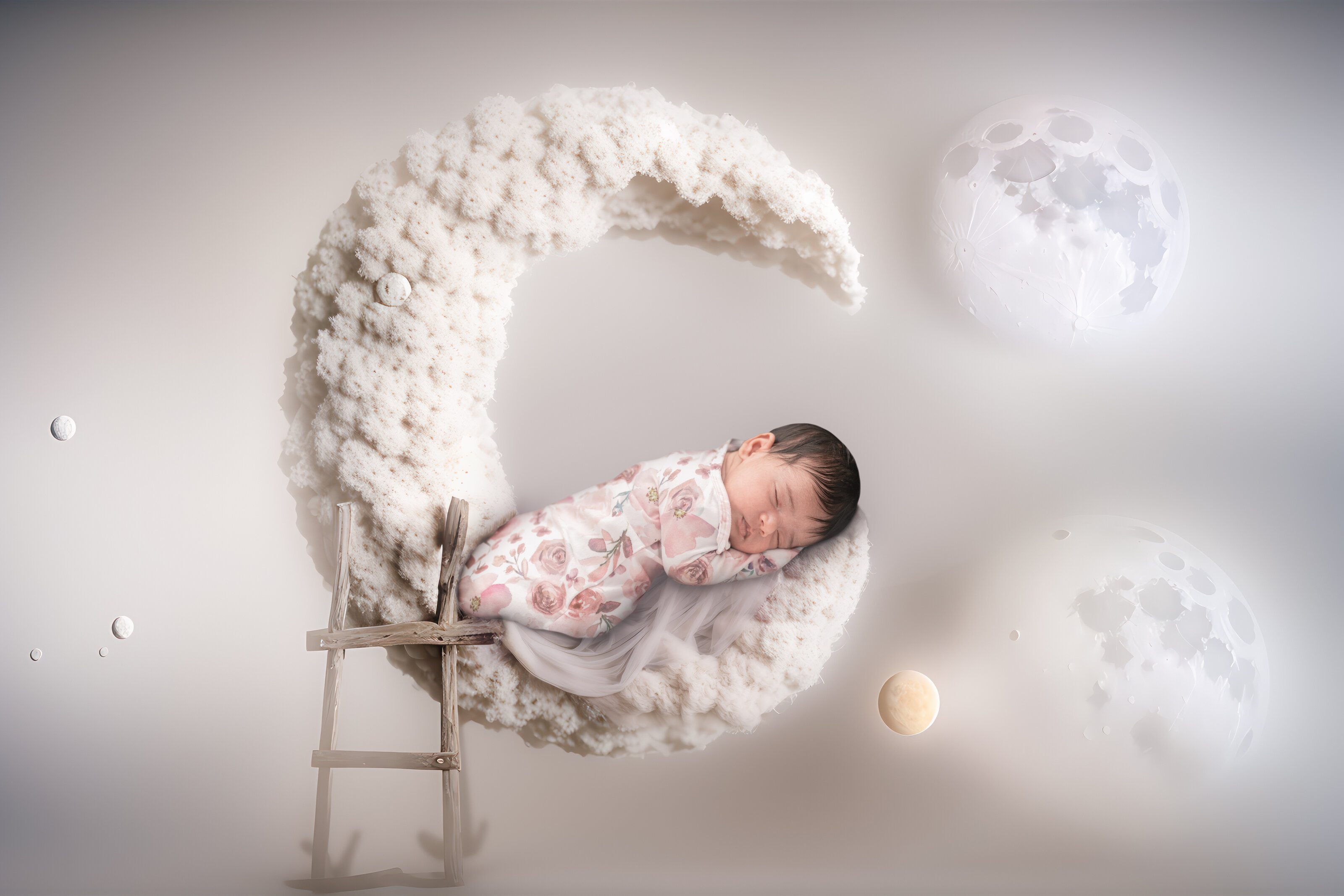 Newborn portrait on a moon set