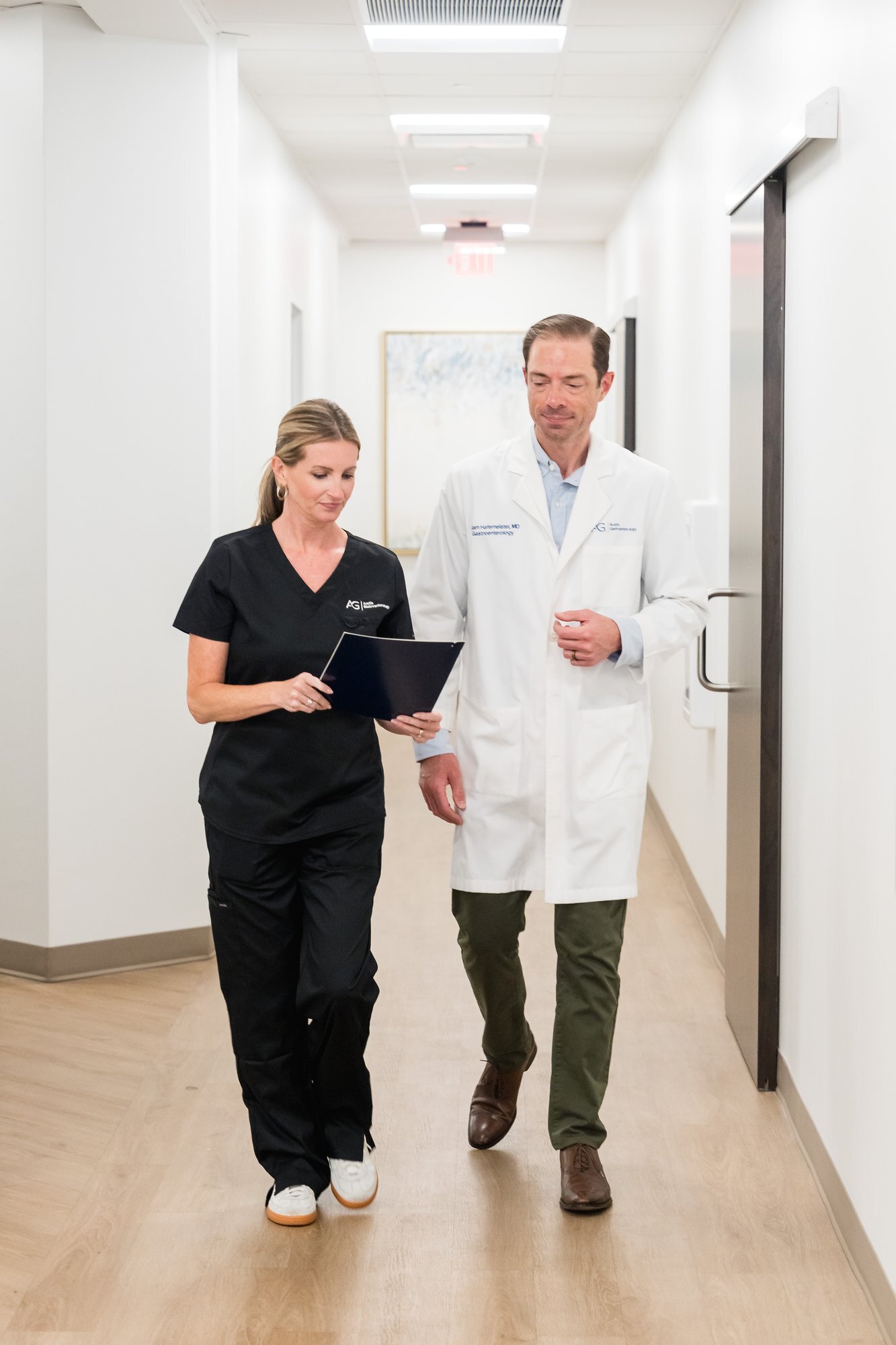 Austin Gastroenterology physician and staff hallway consultation