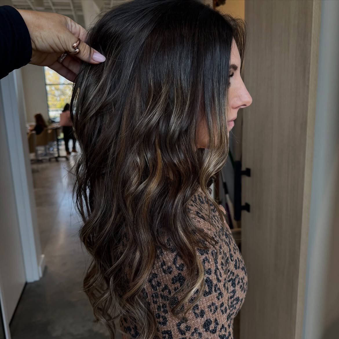 Brunette hair color and hand-tied extensions by the team at Echelon Salon in Eagle, Idaho