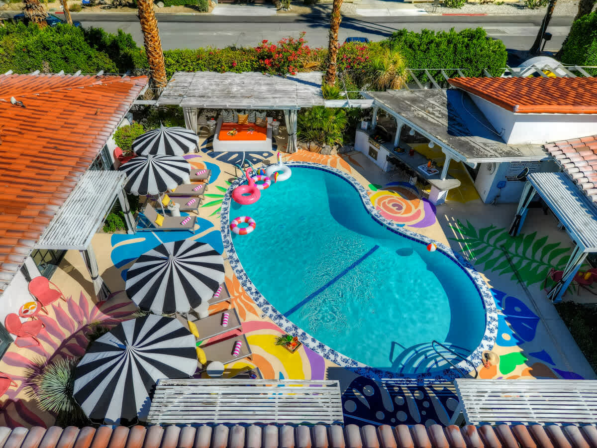 Aerial of the kidney-shaped pool and painted deck