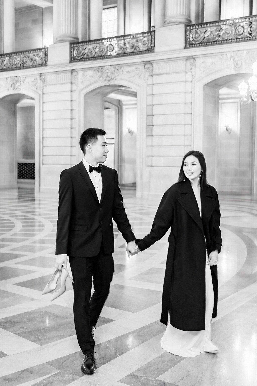 Black and white couple exiting Los Angeles City Hall