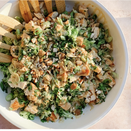 chicken bowl with spinach salad and dressing