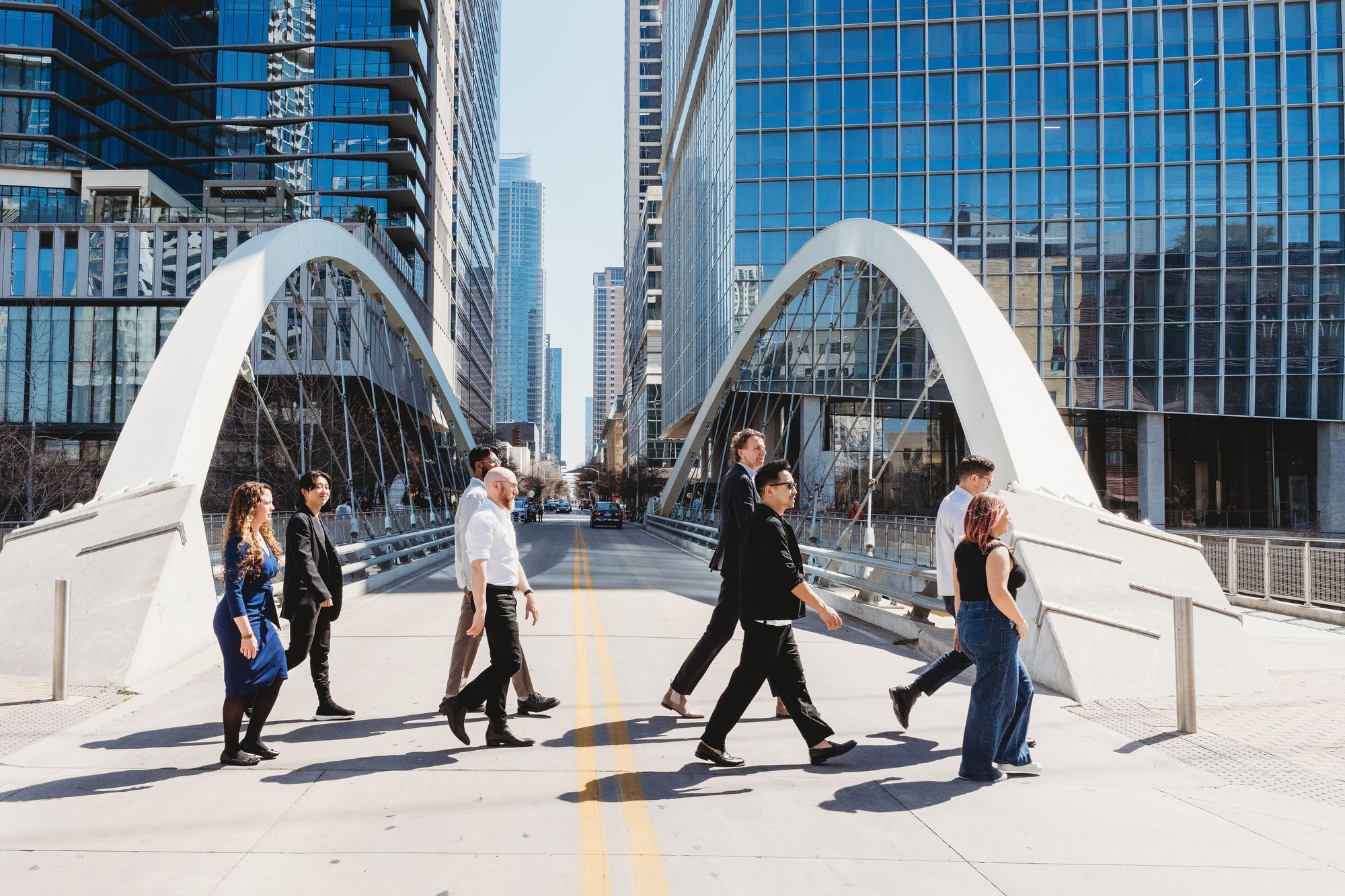 UNS architecture firm team on a pedestrian bridge in Austin