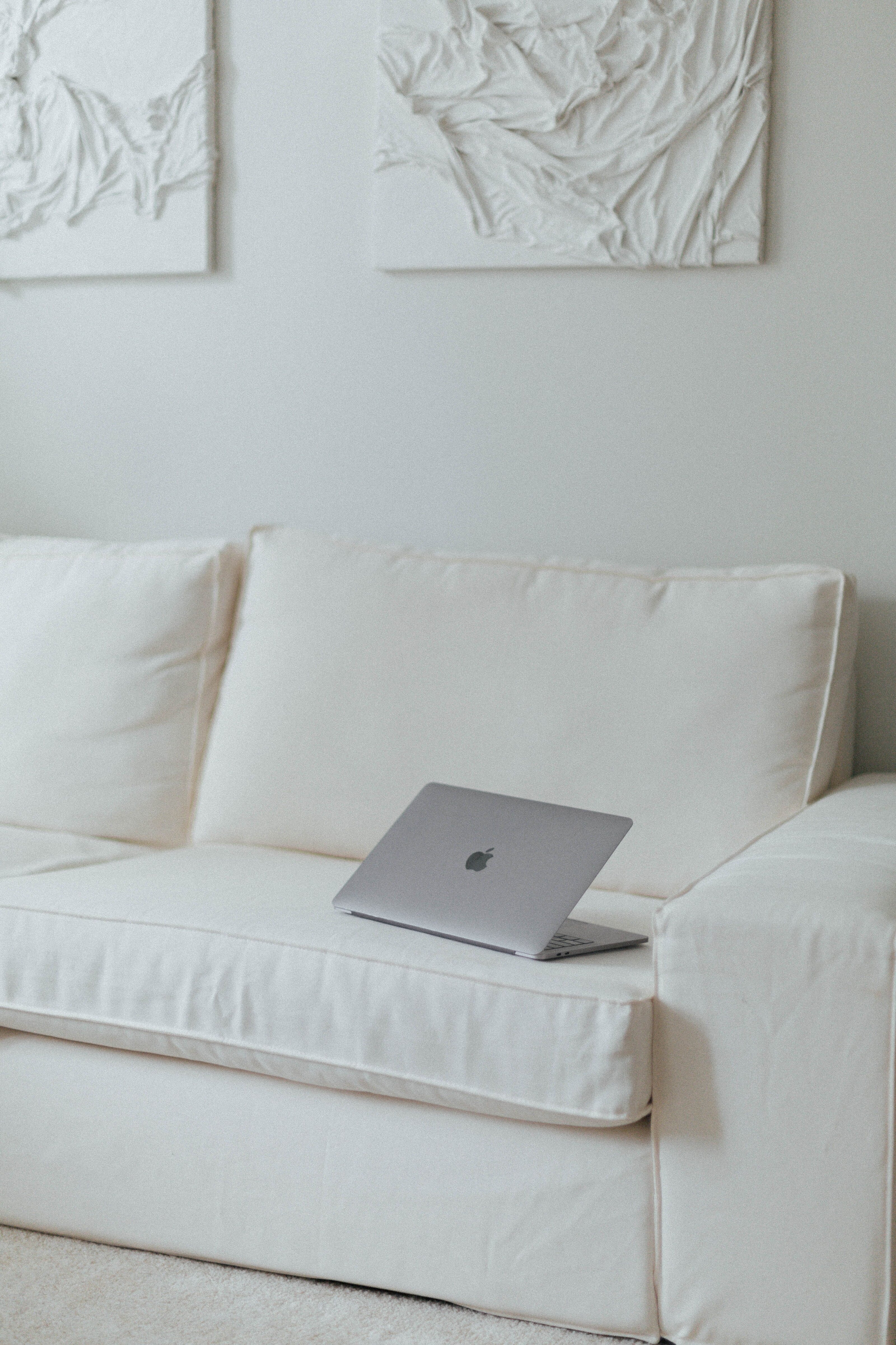 Laptop on a white sofa