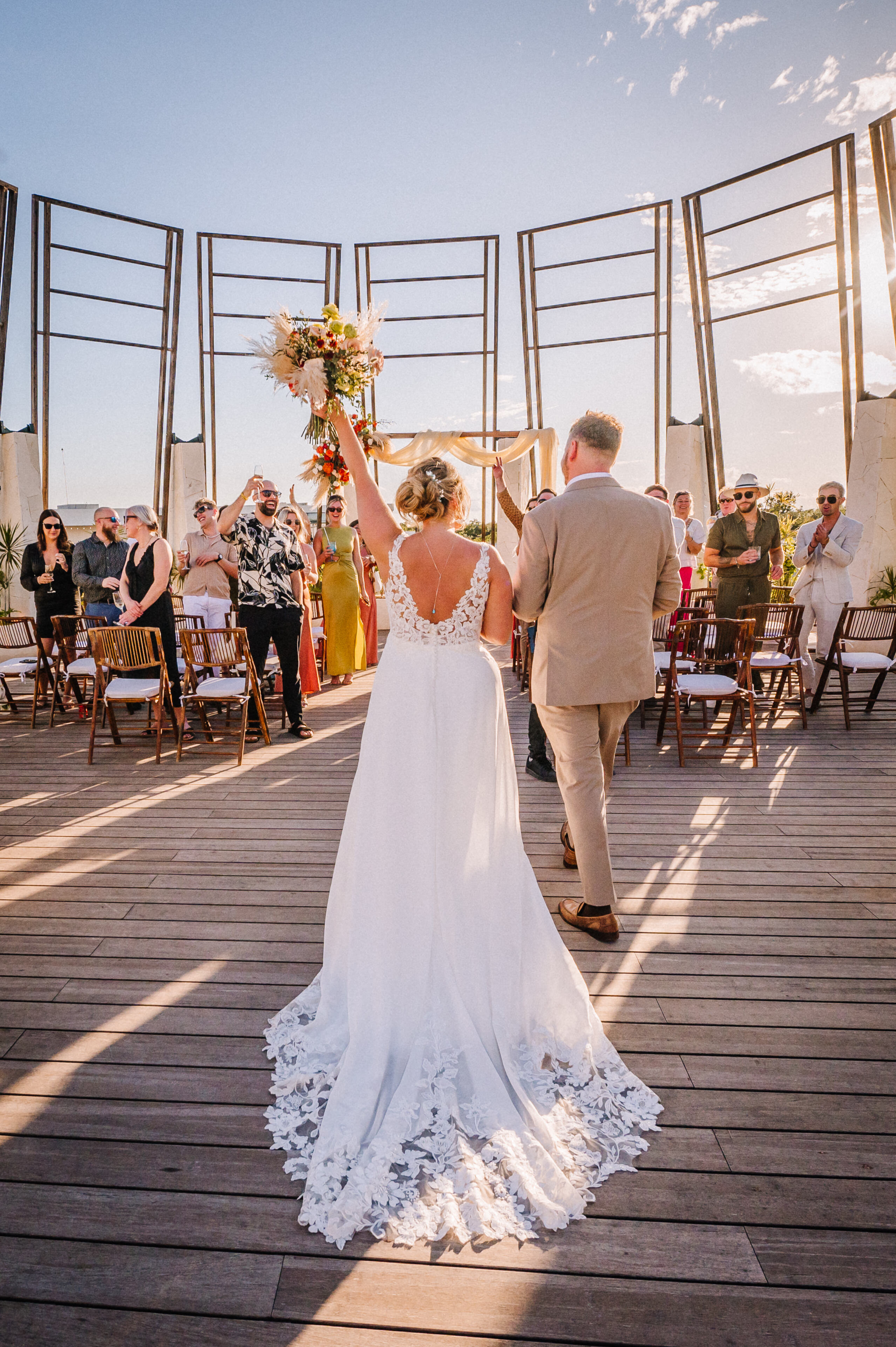 Destination wedding dress surrounded by tropical palms