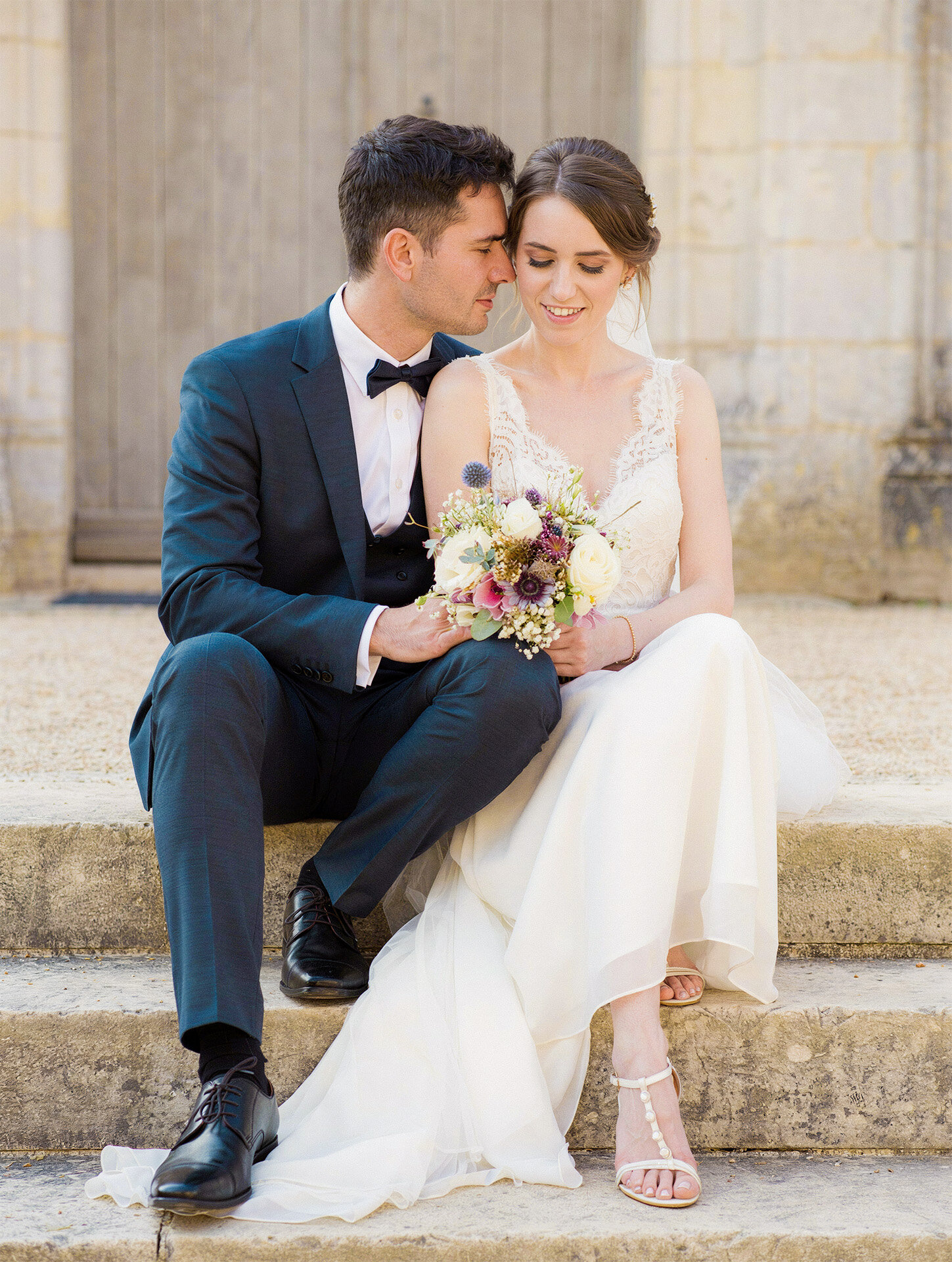 France destination wedding portrait on stone church steps in Toulouse