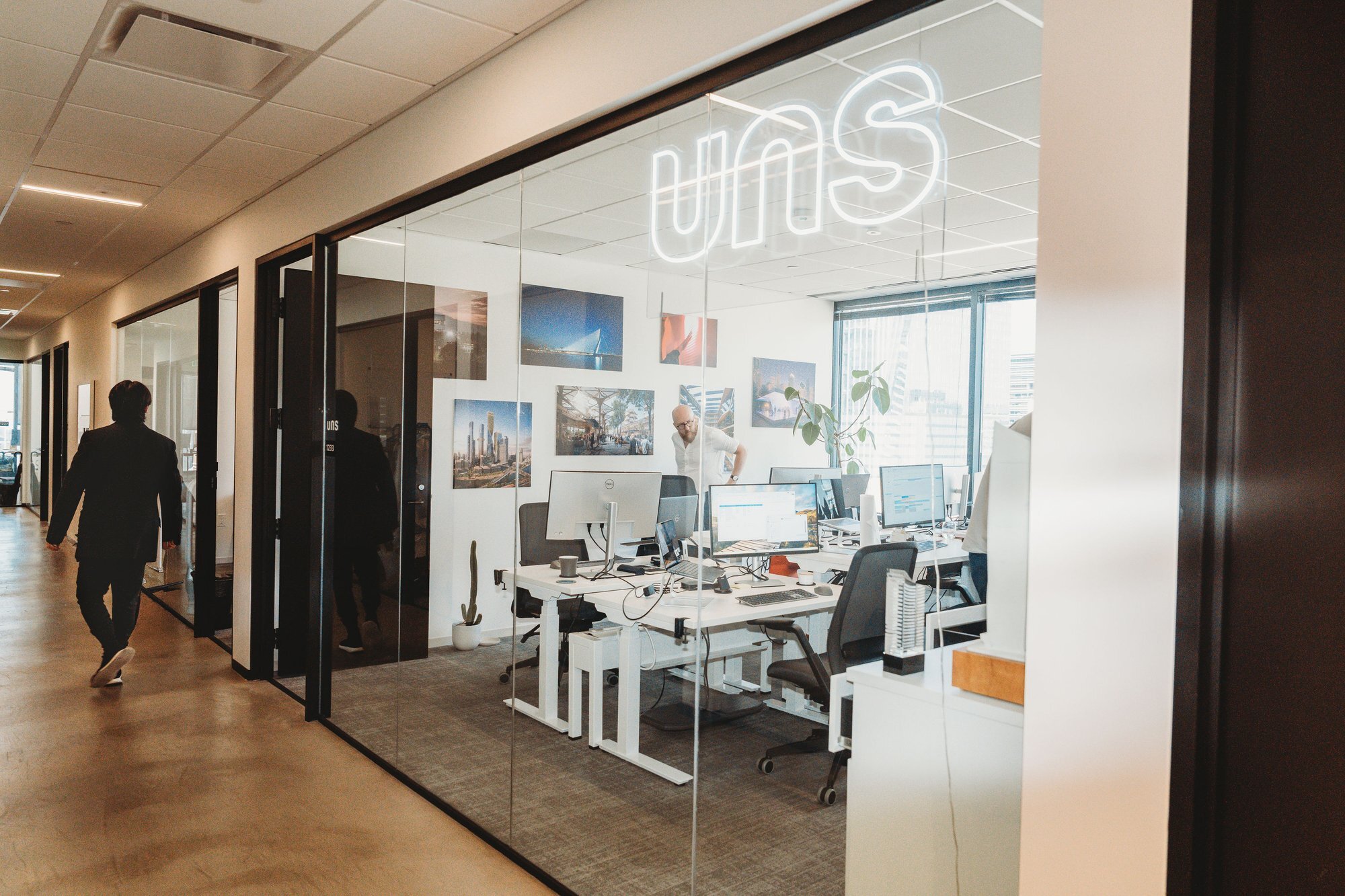 UNS architecture firm office hallway with neon sign in Austin