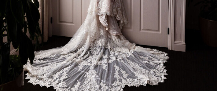 Detailed lace train of a bride’s wedding gown