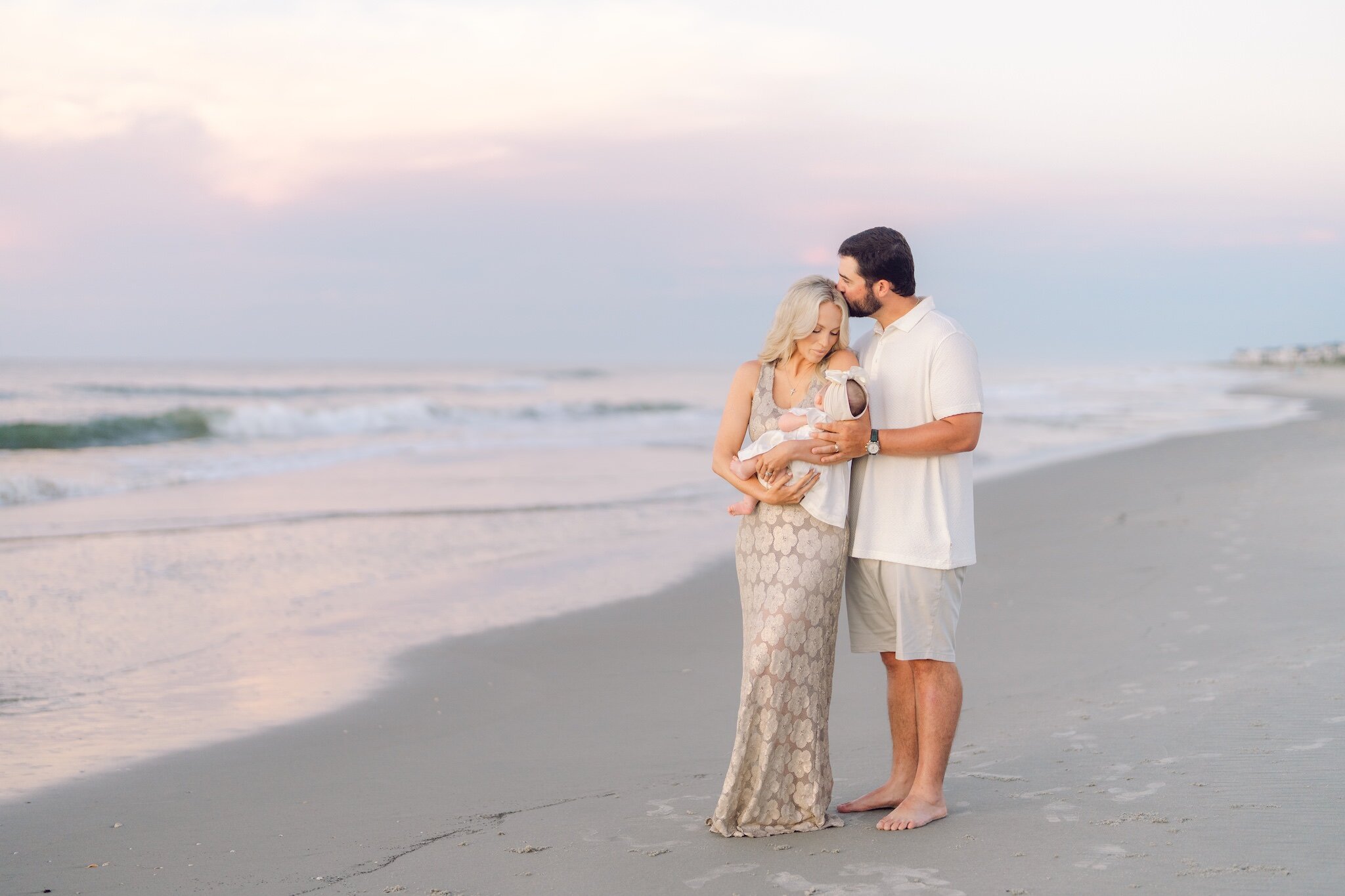 Sunrise family photography session on the beach in Myrtle Beach with parents and children by Pasha Belman Photography