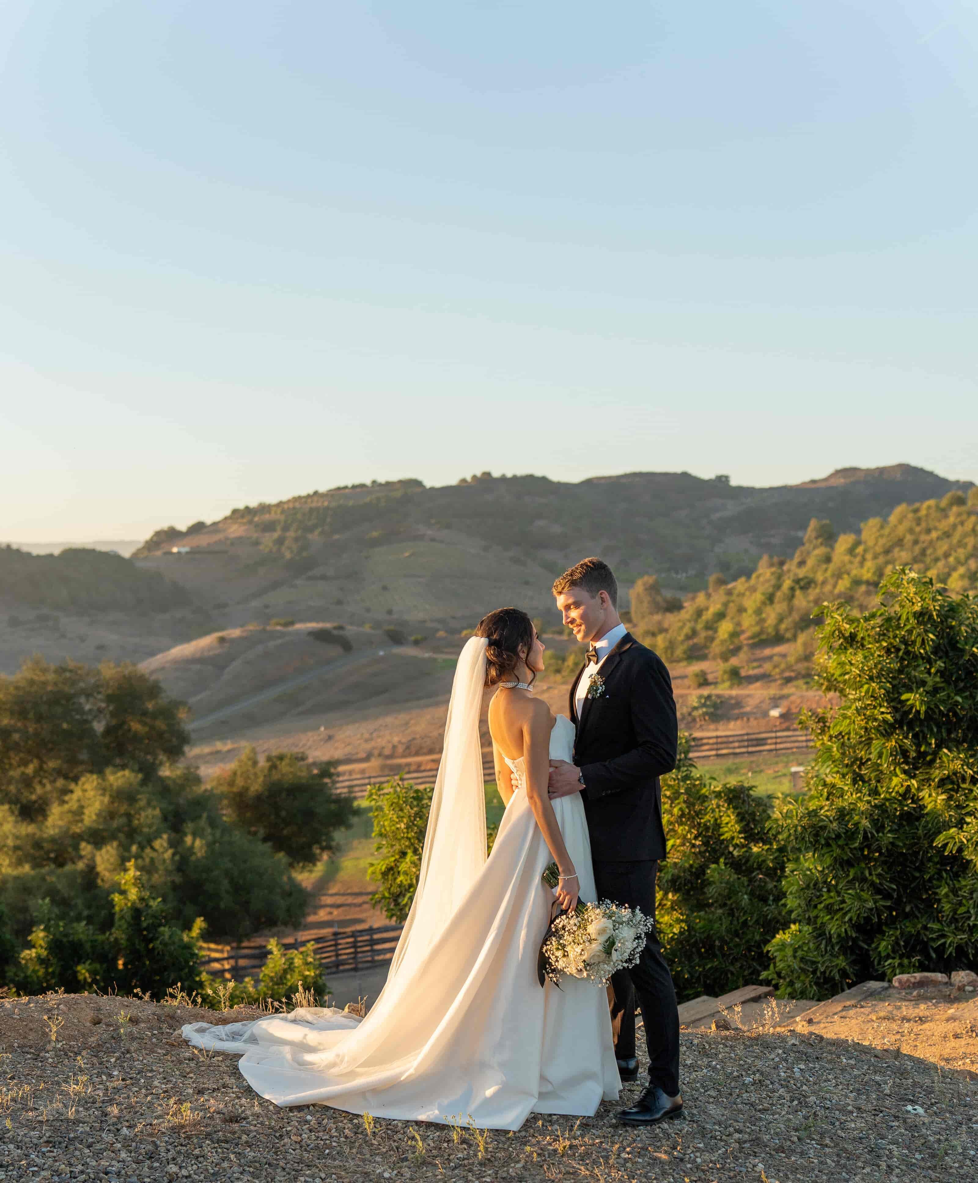 Couple on a hilltop at golden hour, wedding and elopement photographer. Temecula, California.