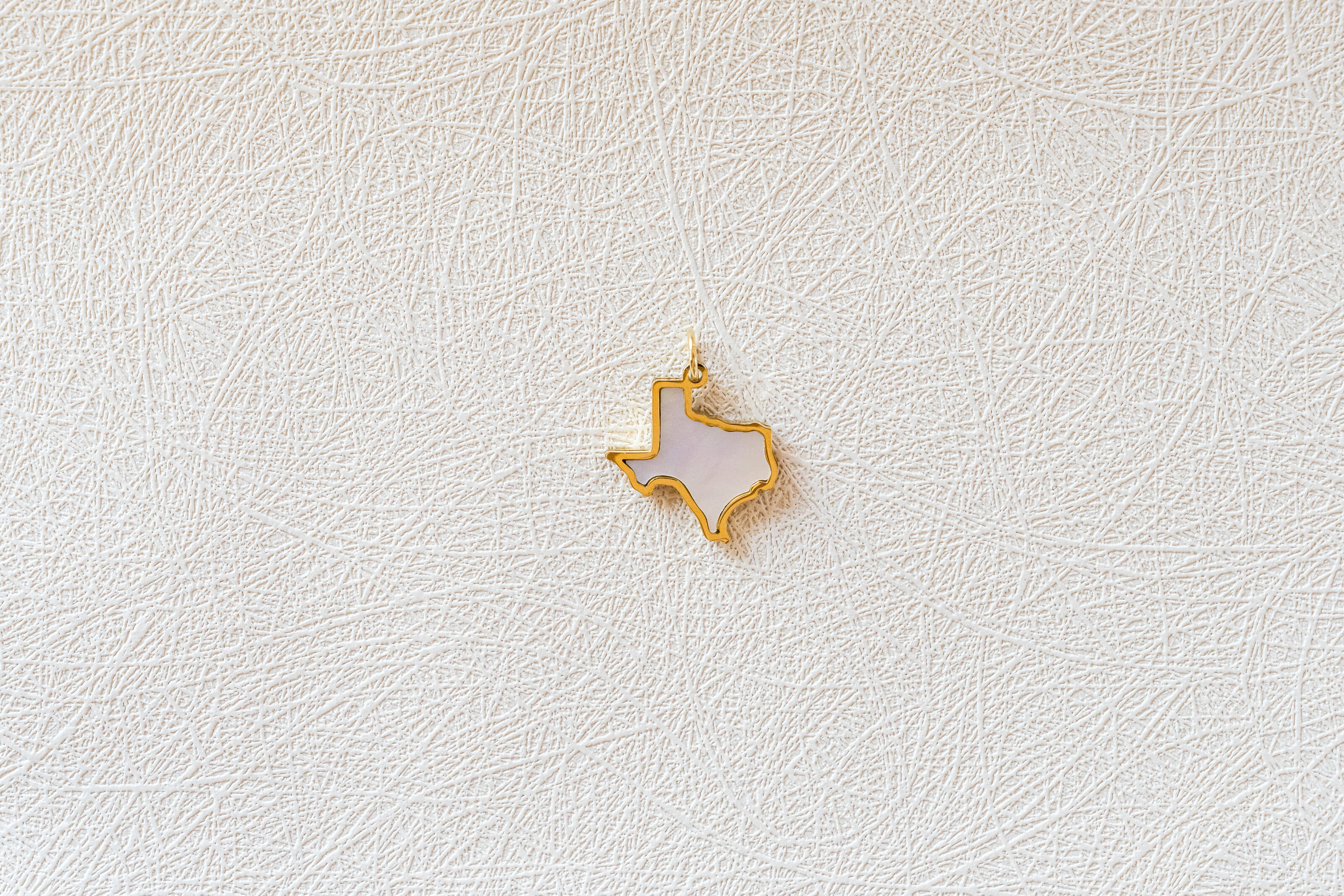 Flatlay of Charm Theory Texas charm