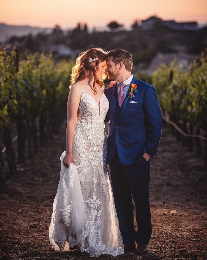 Bride and groom sharing a sunset portrait in a Southern California vineyard
