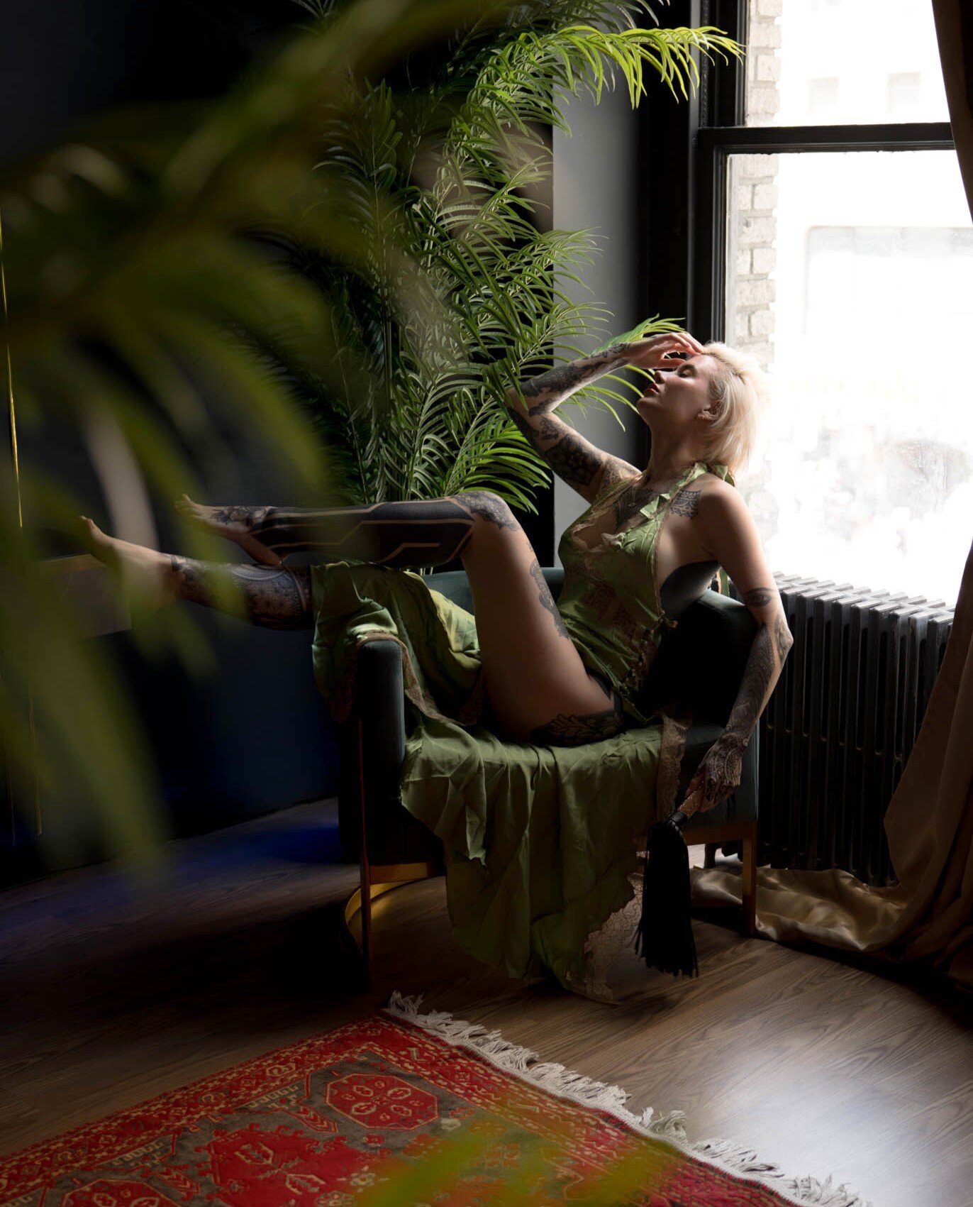 Woman wearing a vintage slip dress during her boudoir session in Baltimore