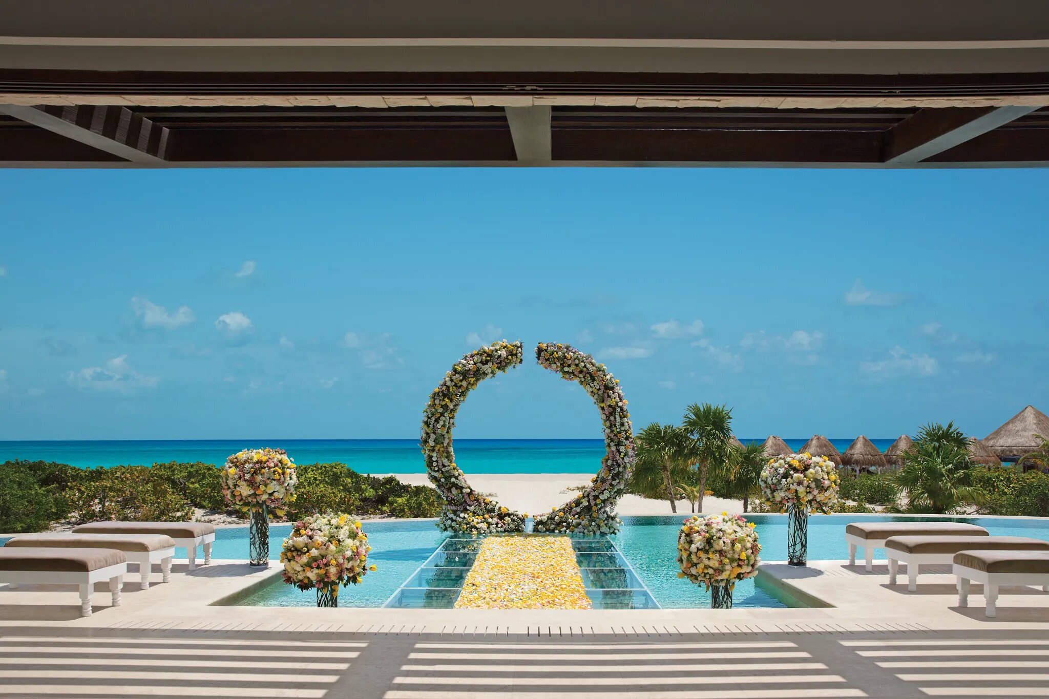 Oceanfront wedding ceremony setup at Dreams Playa Mujeres in Costa Mujeres