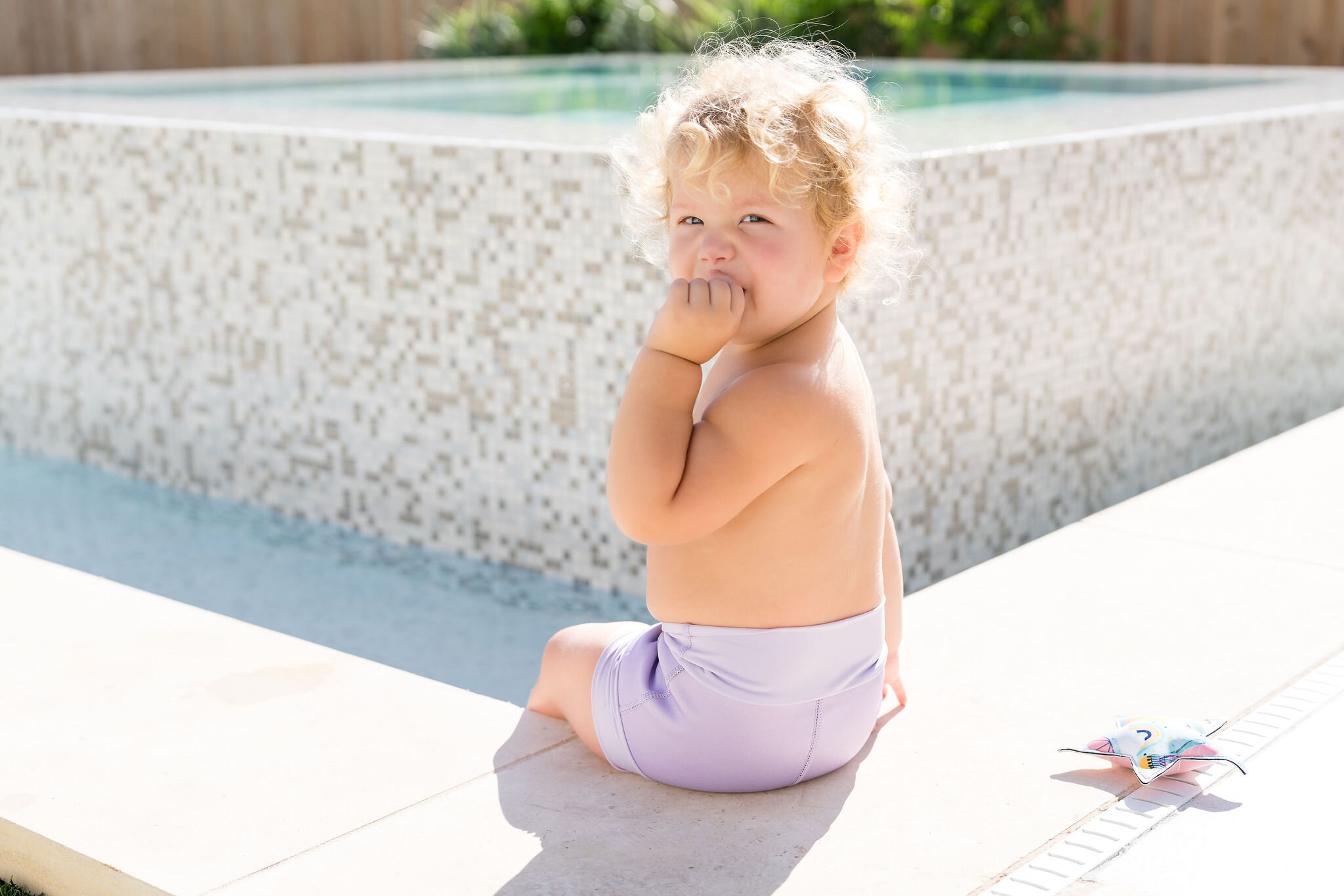 Toddler wearing lavender swim bottoms for Splash About